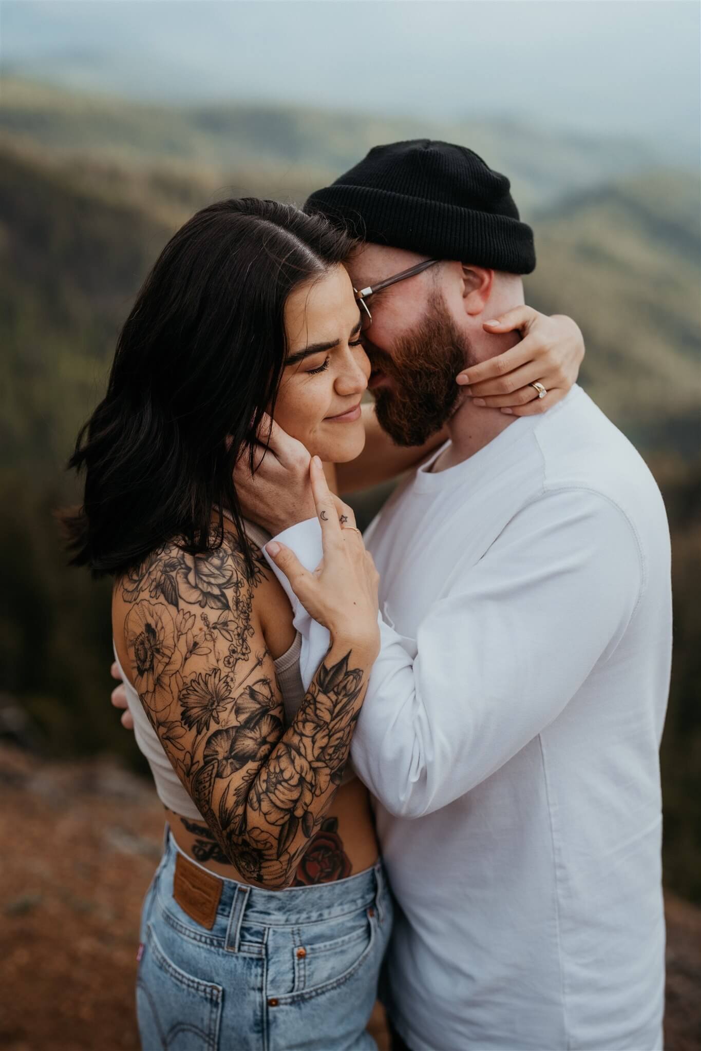 Couple hugging during anniversary photos at Red Top Lookout