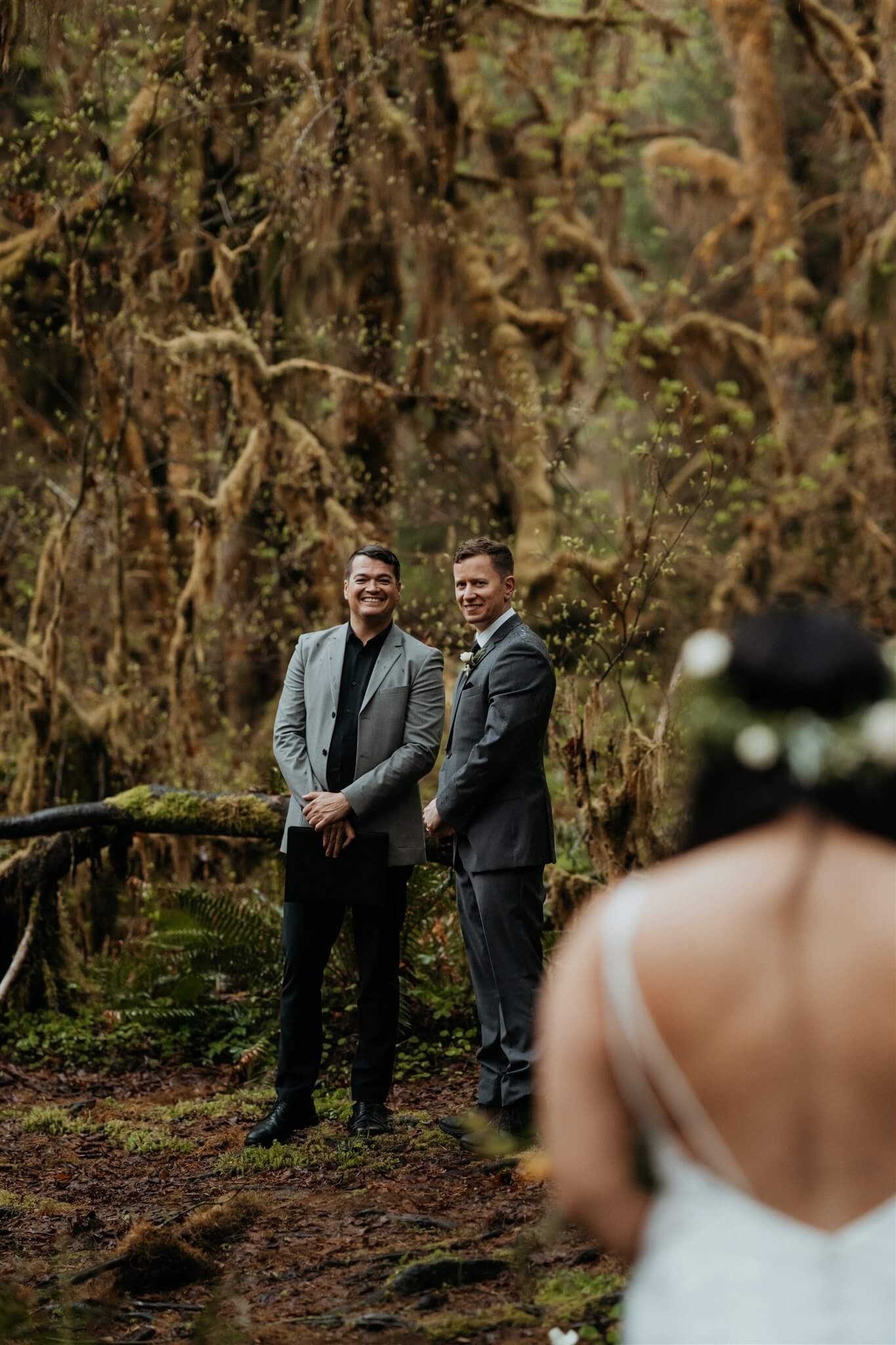 Groom waiting for bride at the end of aisle in the Hoh Rainforest