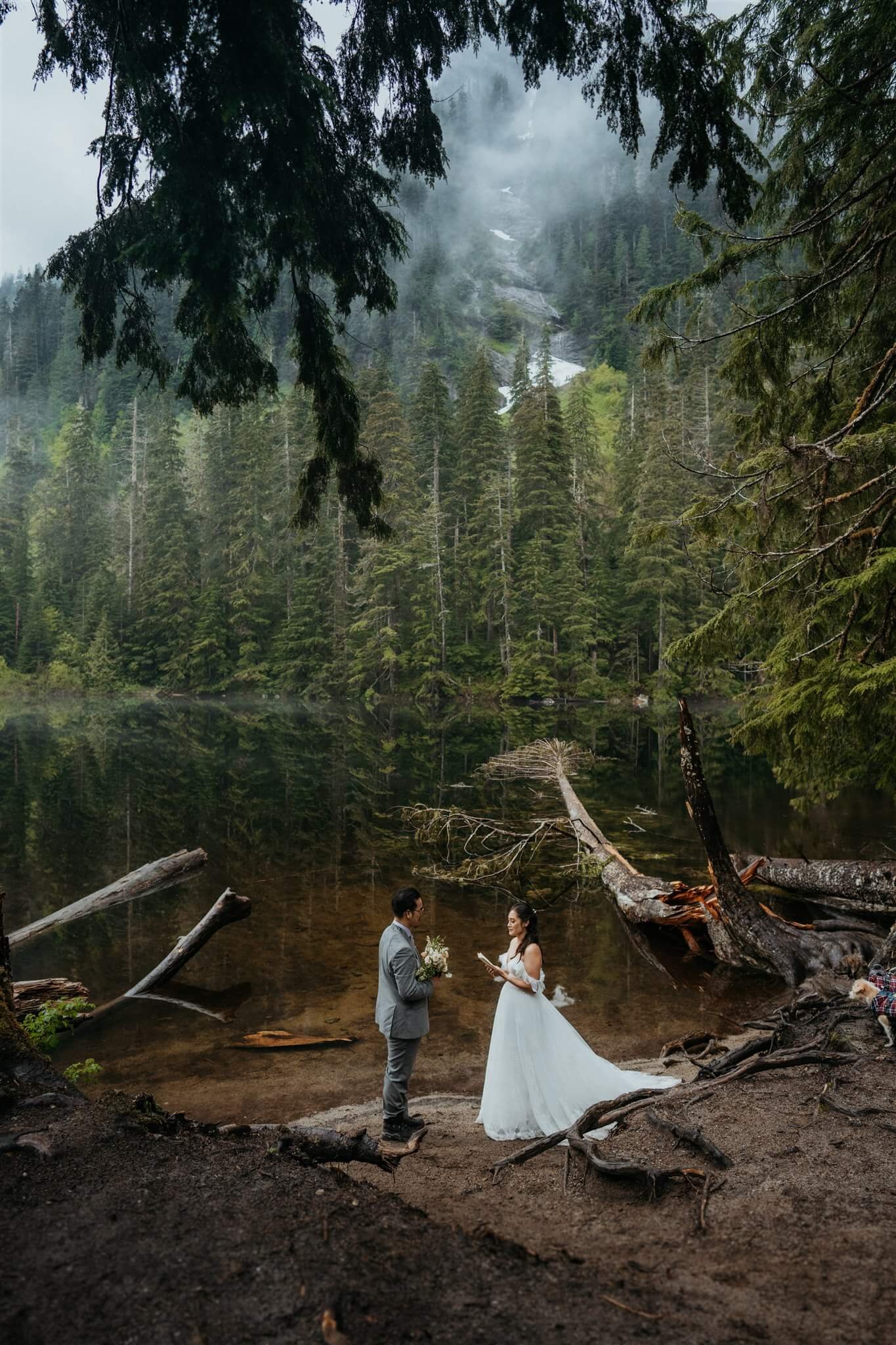 Bride and groom exchange vows near Barclay Lake