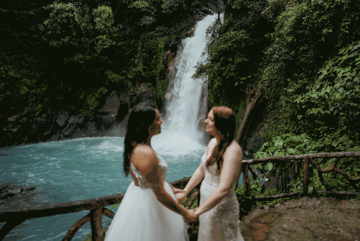 Wedding portraits next to a waterfall at Costa Rica elopement