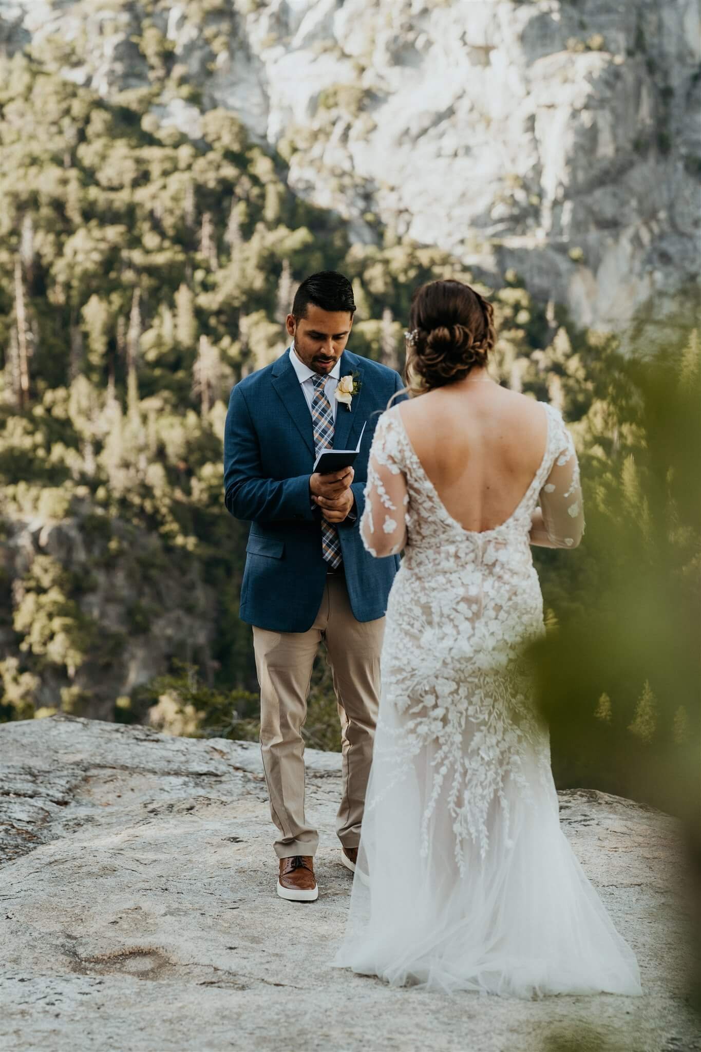 Bride and groom read personal vows at Tunnel View elopement