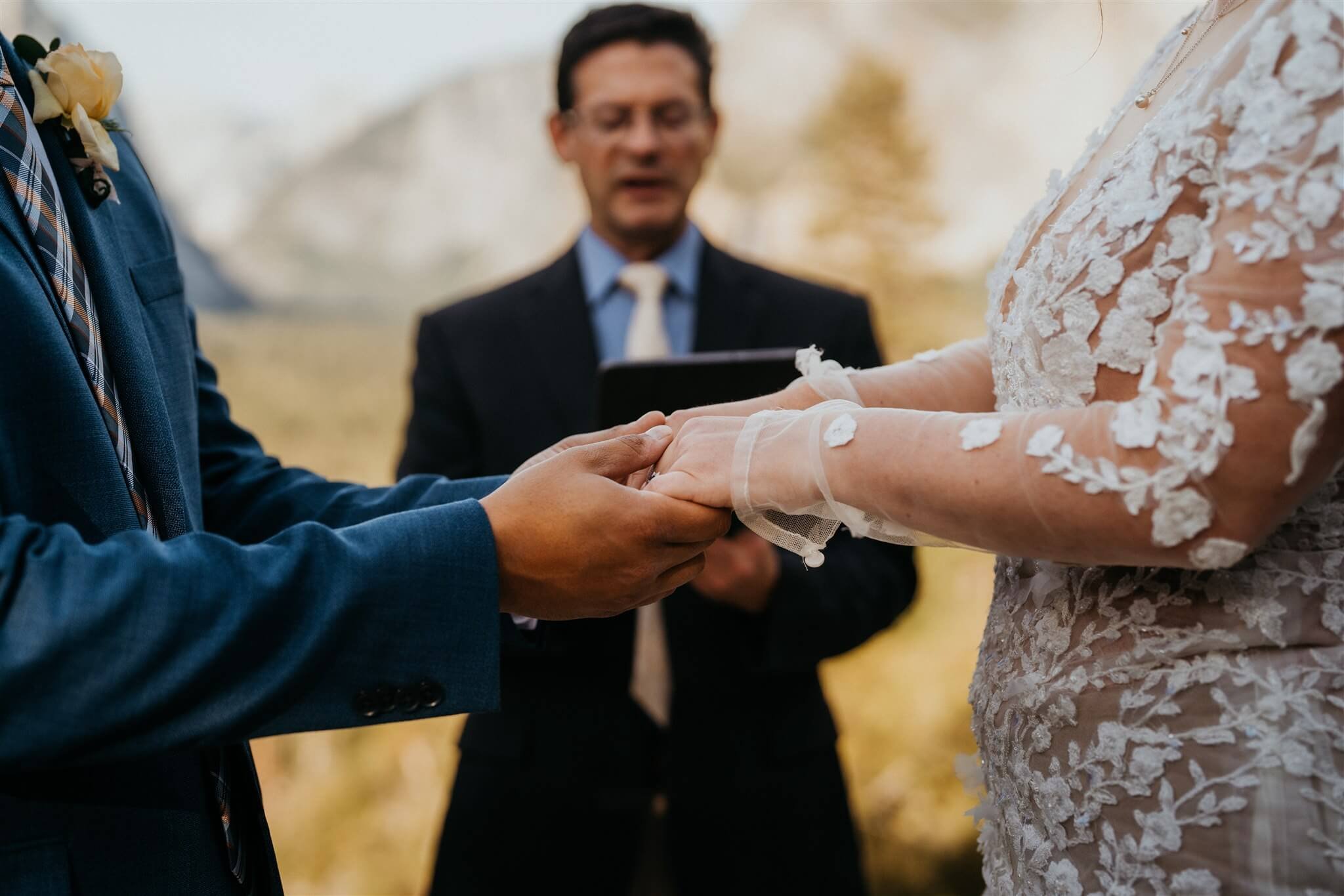 Bride and groom hold hands while they elope in Yosemite