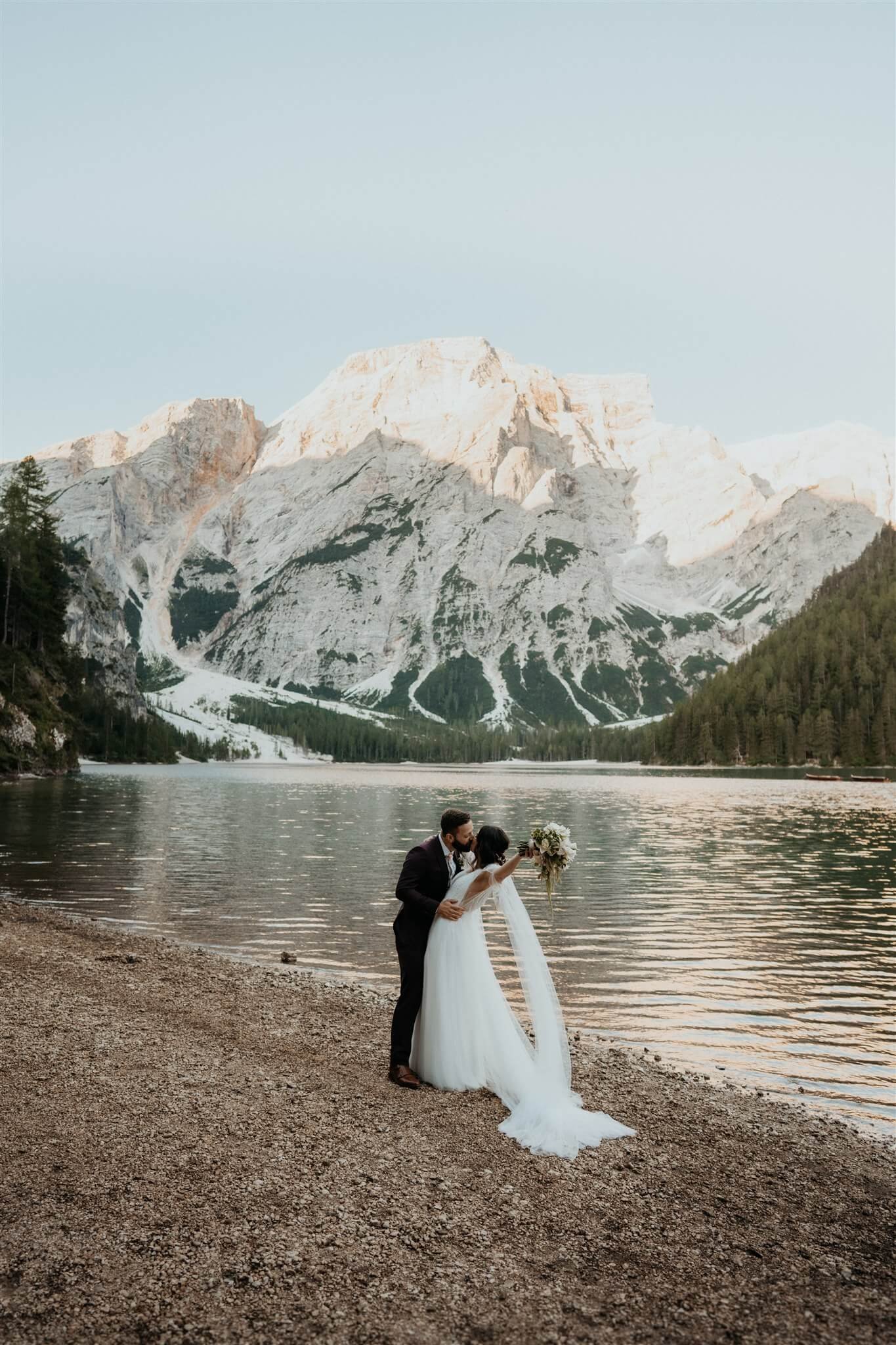 Bride and groom kiss during intimate vow renewal in Italy