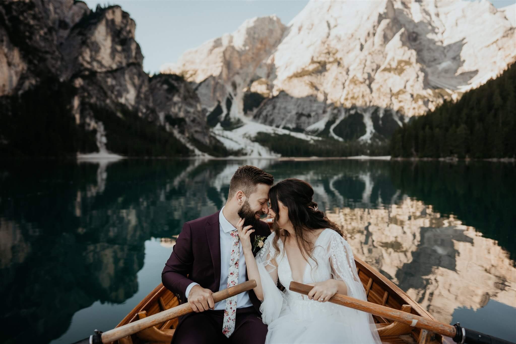 Bride and groom in canoe on Lago di Braies