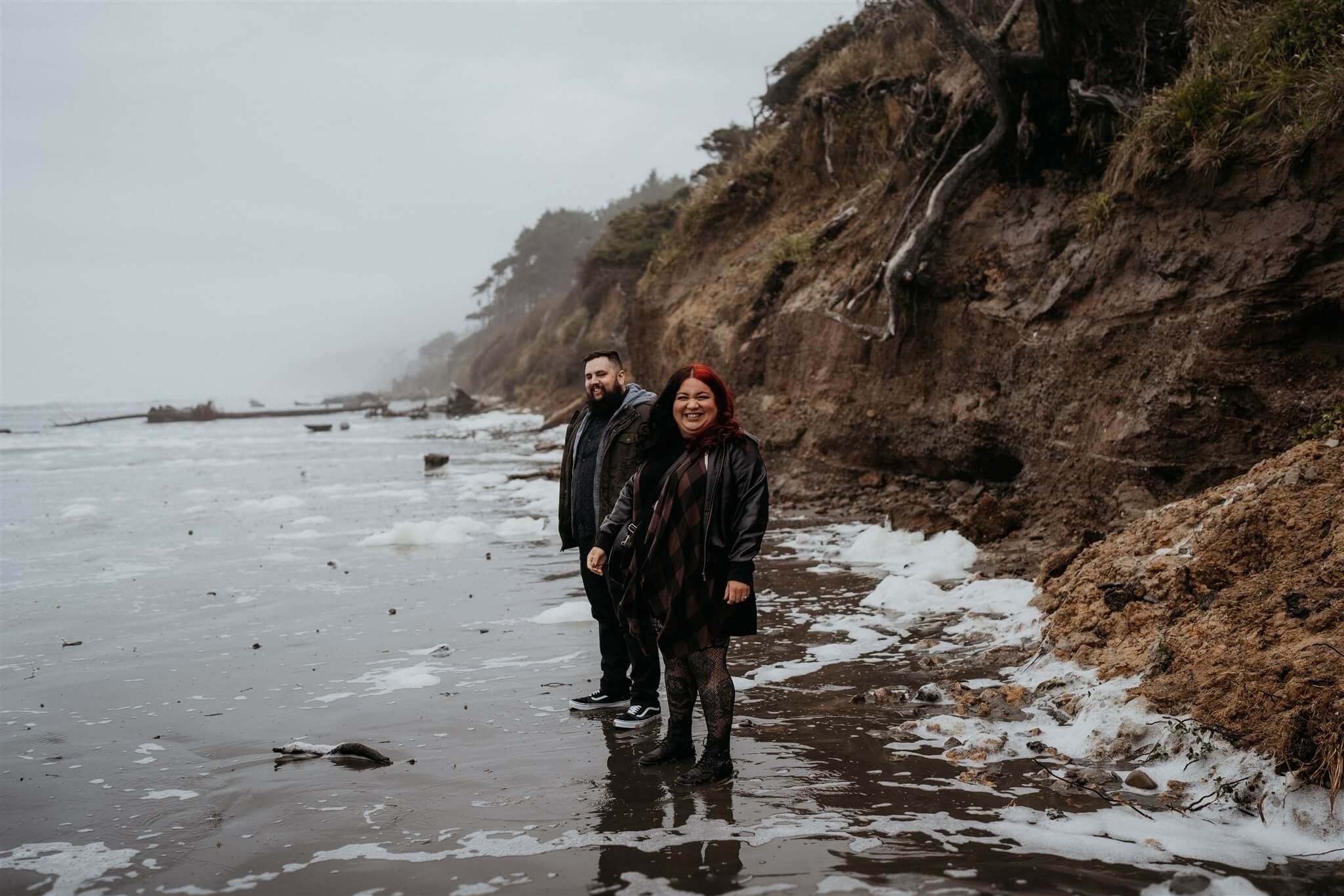 Couple photos on the beach for Halloween engagement session