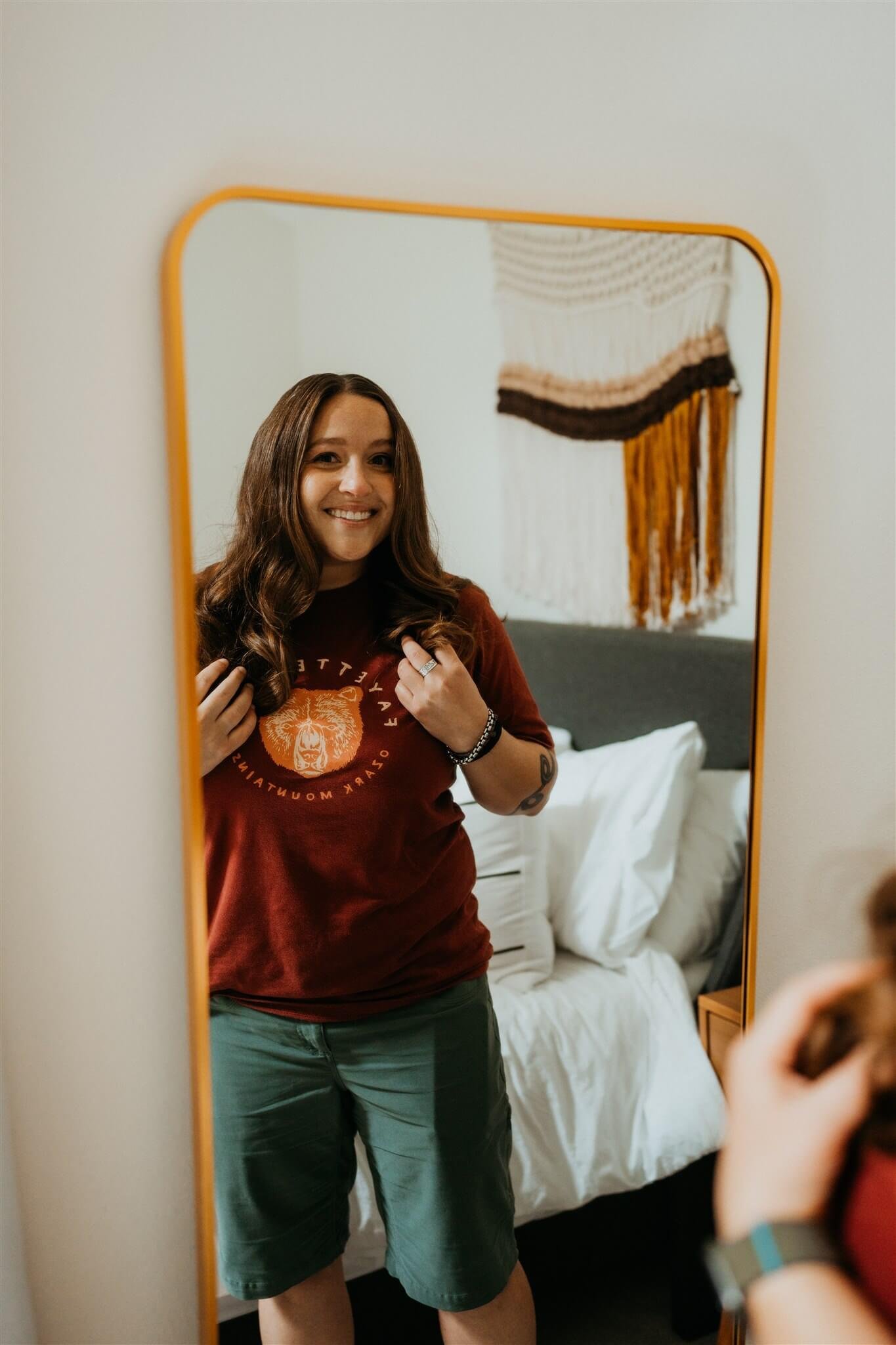 Bride getting ready for waterfall elopement in Oregon