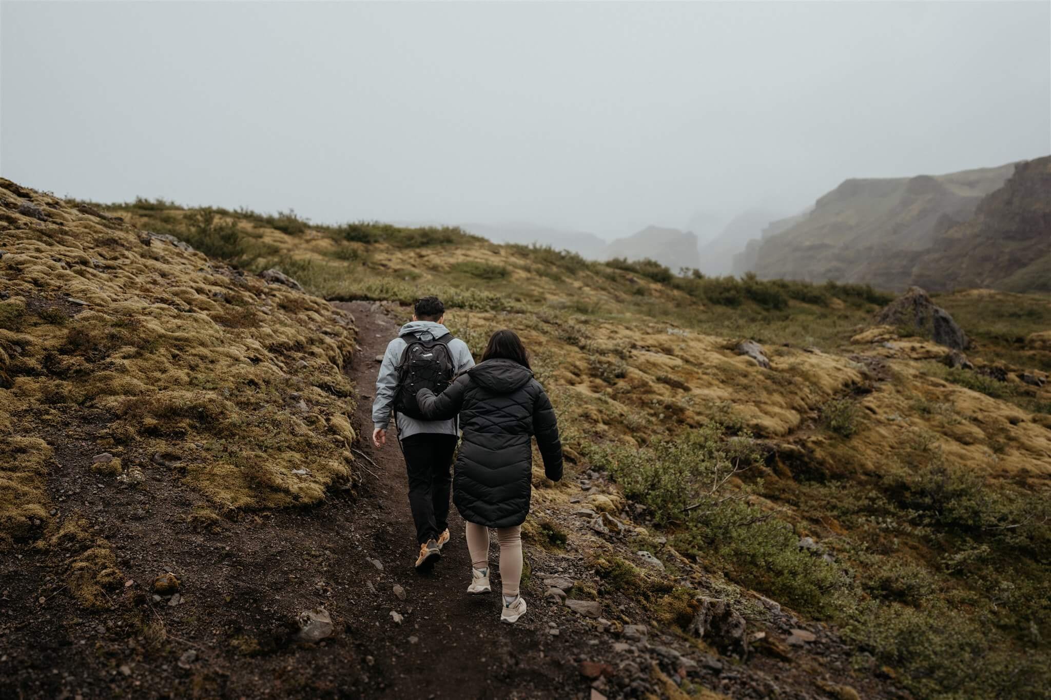 Bride and groom hiking a trail for their elopement in Iceland