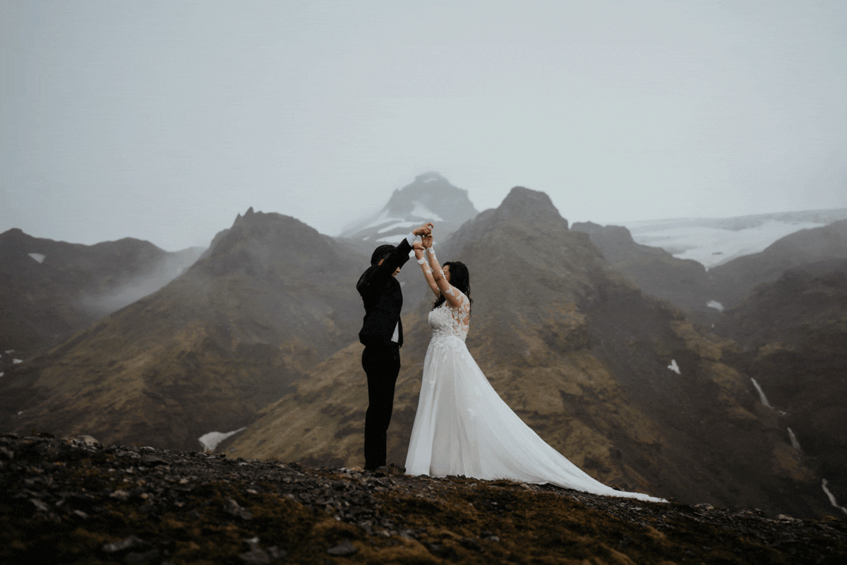 Bride and groom cheer after eloping in Iceland