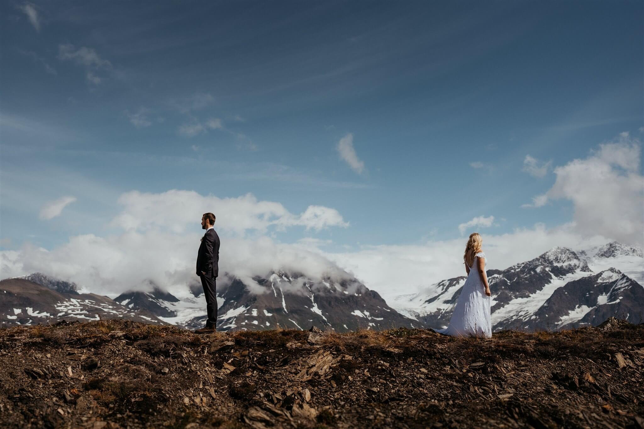 Bride and groom first look overlooking a glacier in Alaska