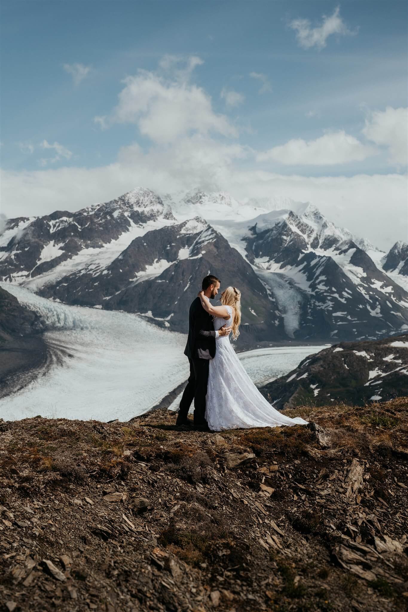 Bride and groom first look overlooking a glacier in Alaska