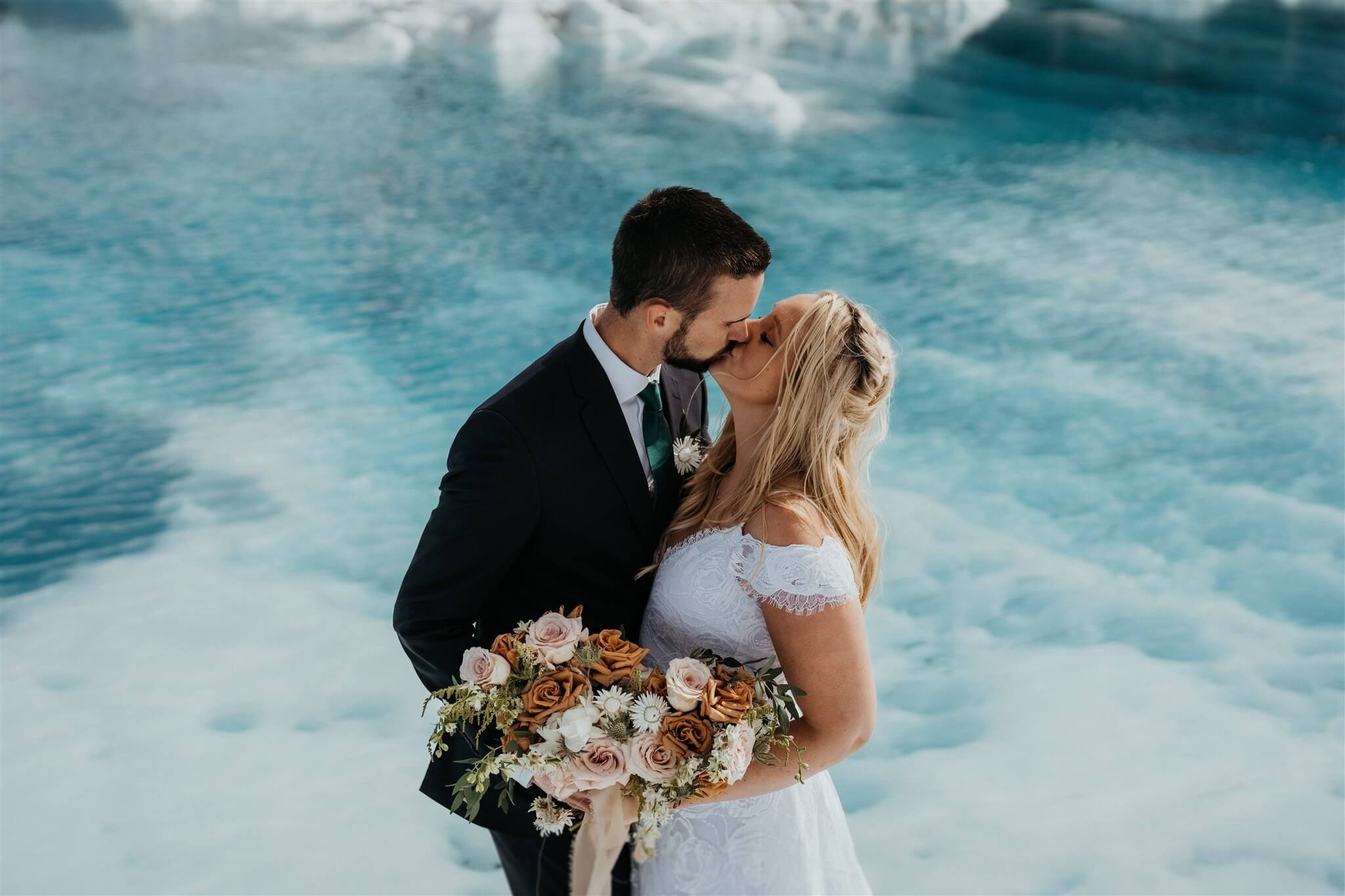 Bride and groom couple portraits during helicopter elopement in Alaska