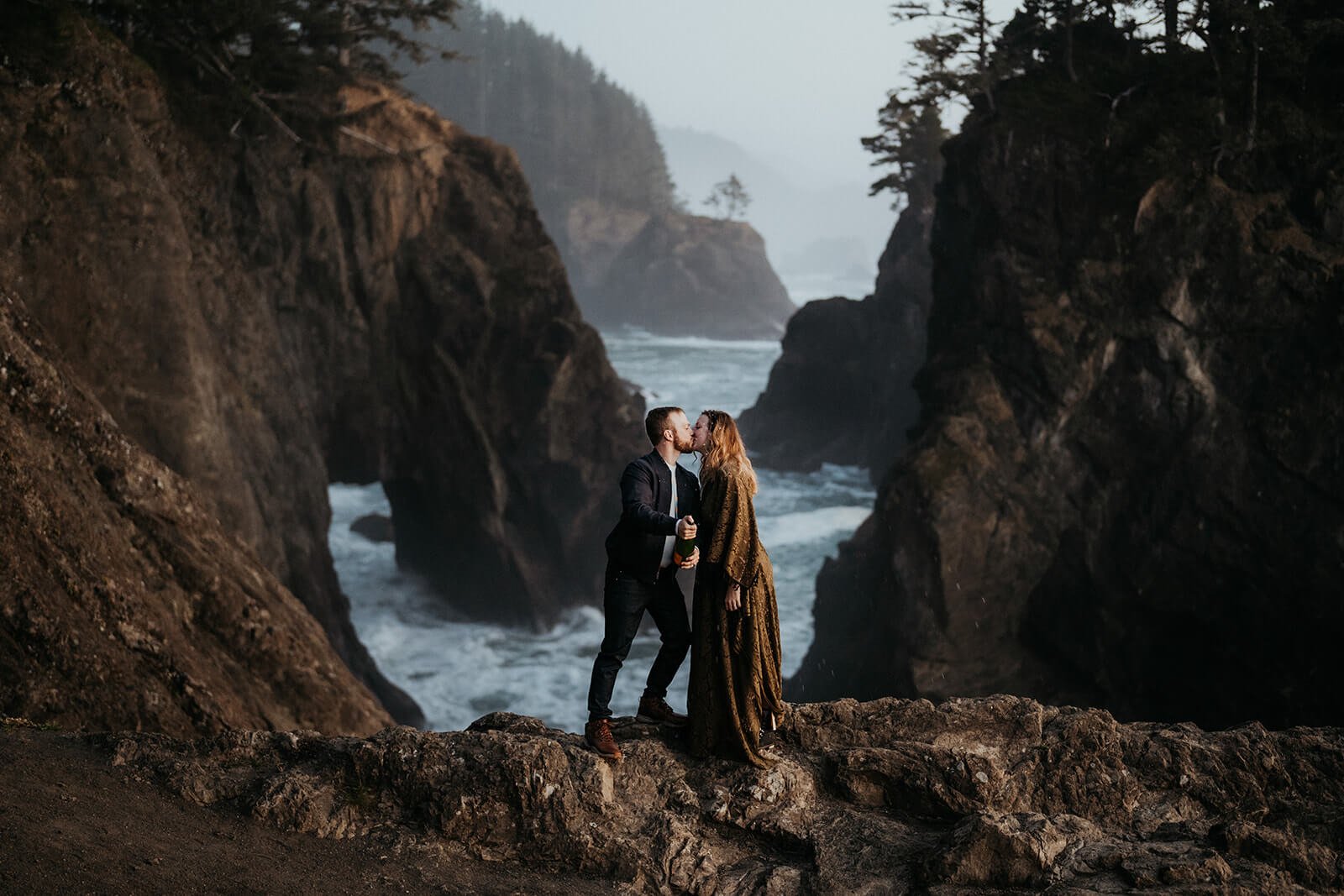 Couple kissing during anniversary photos on the Oregon Coast