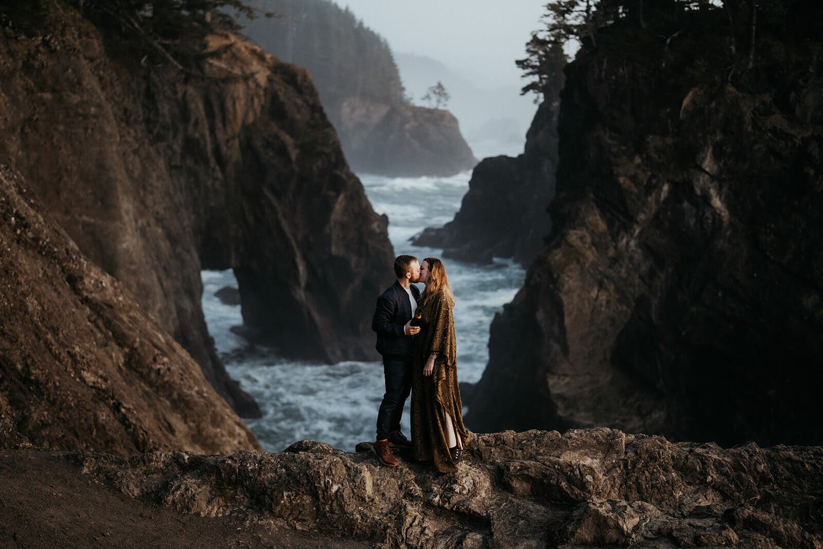 Couple kissing during anniversary photos on the Oregon Coast