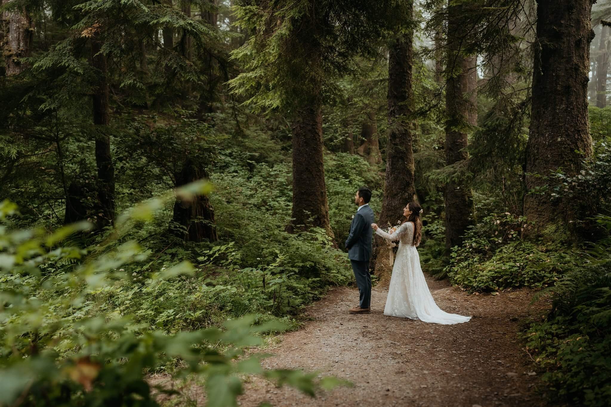 Bride and groom first look in the forest in Olympic National Park