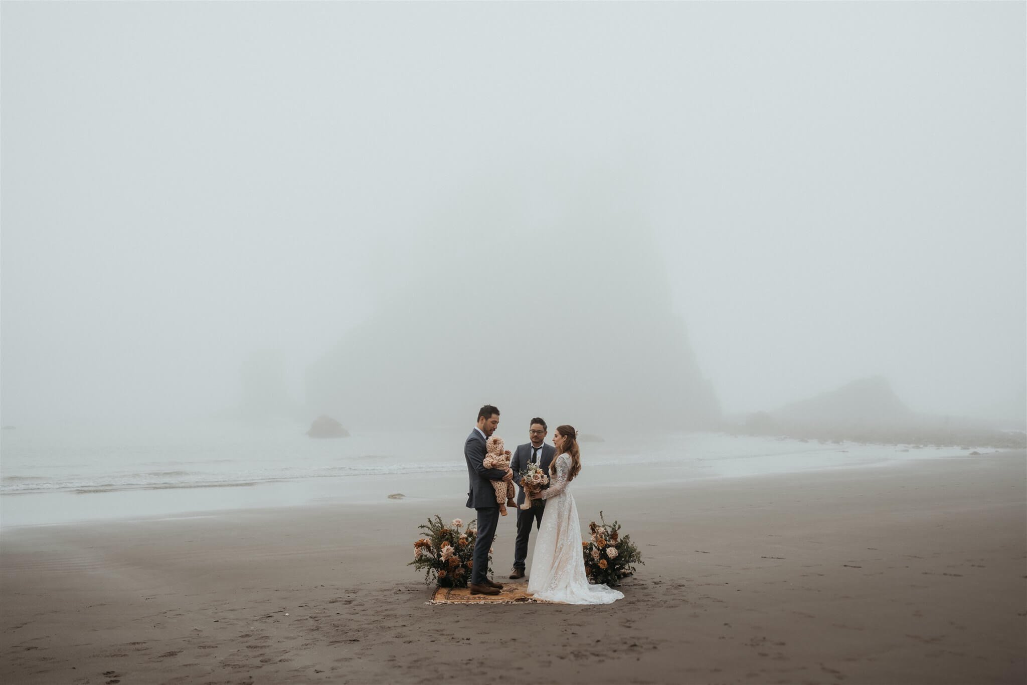 Bride and groom eloping with family at La Push Beach