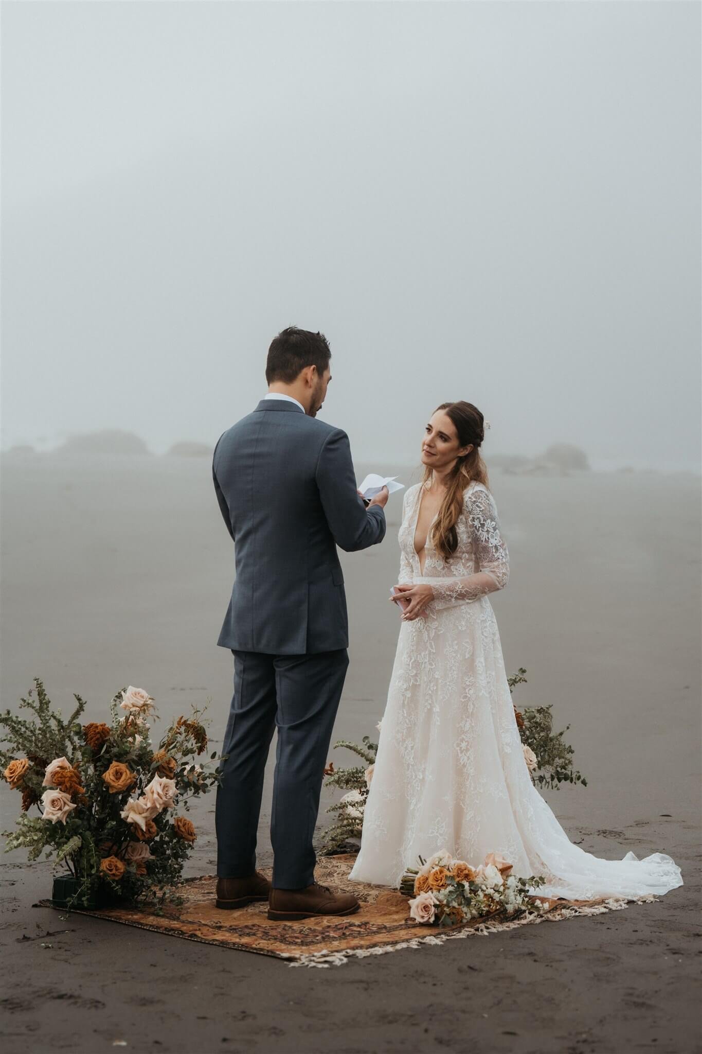 Bride and groom exchange vows at La Push Beach elopement