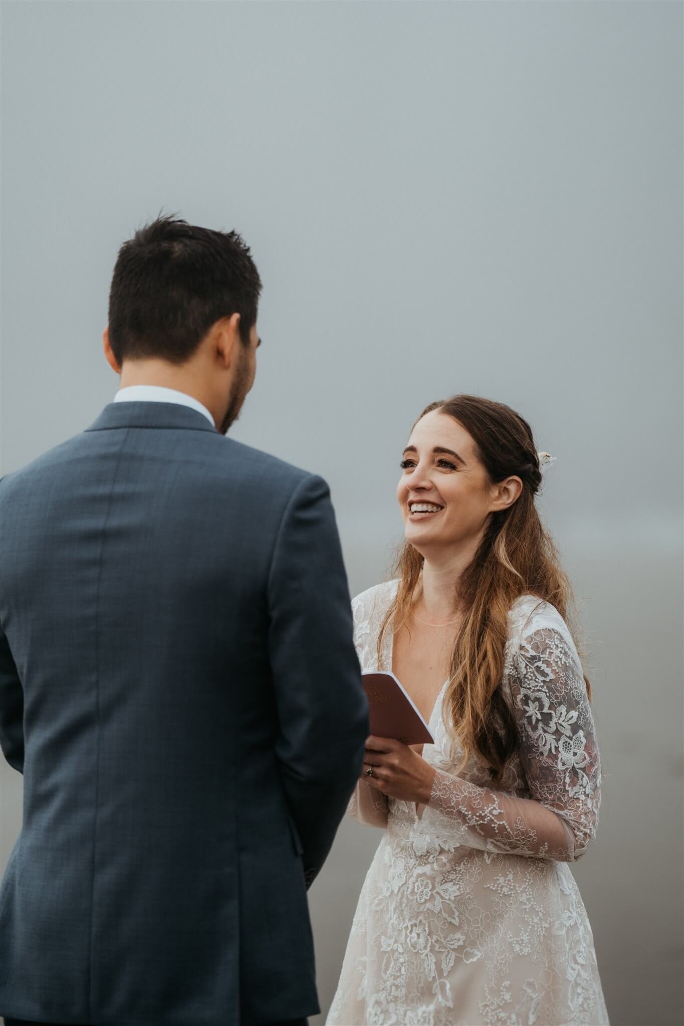 Bride and groom exchange vows at La Push Beach elopement