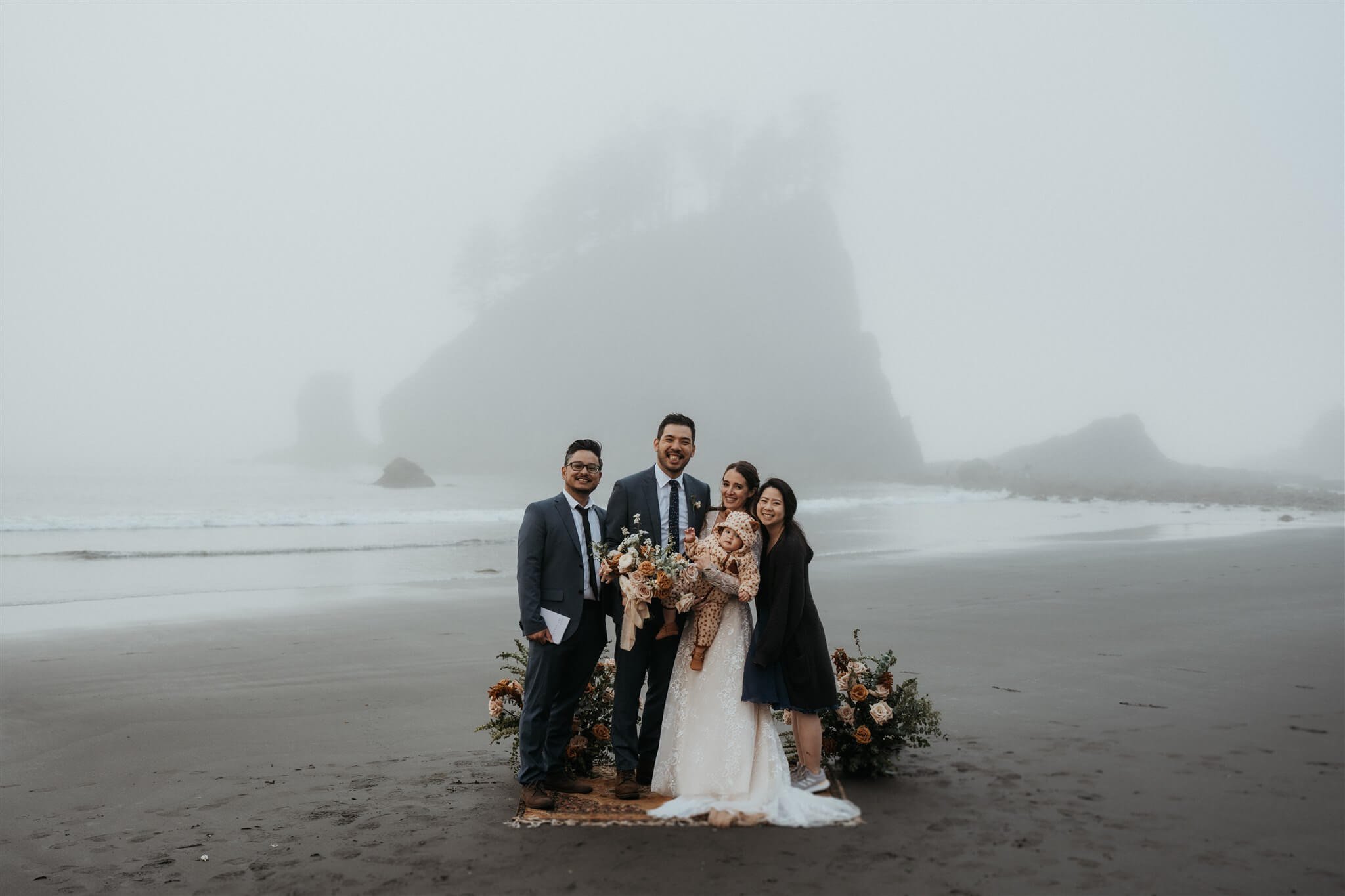 Bride and groom eloping with family at La Push Beach