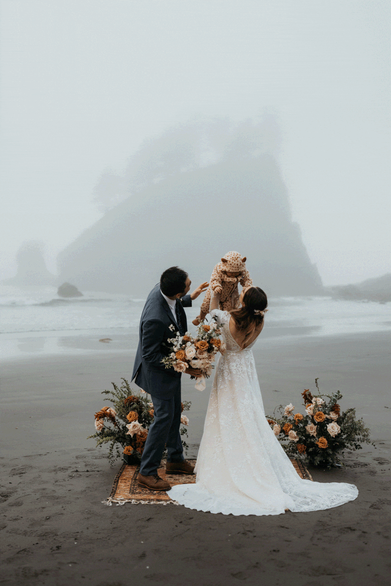 Bride and groom celebrating elopement with baby at La Push Beach