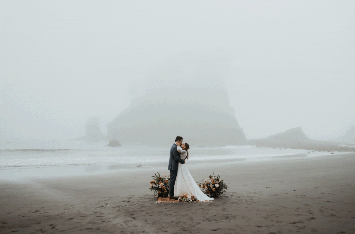 Bride and groom kiss during elopement with Family at La Push Beach