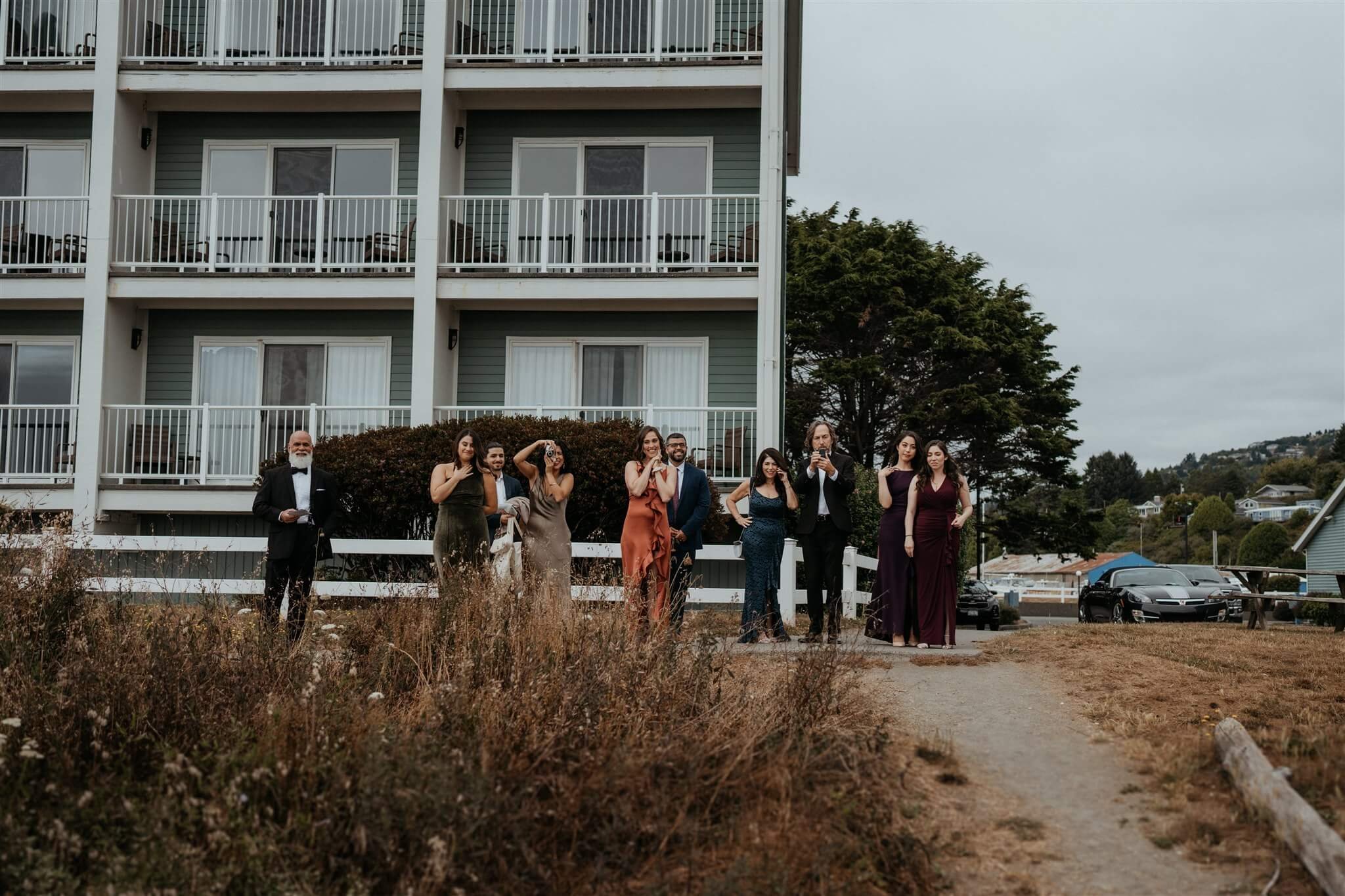 wedding party watching brides' first look from afar