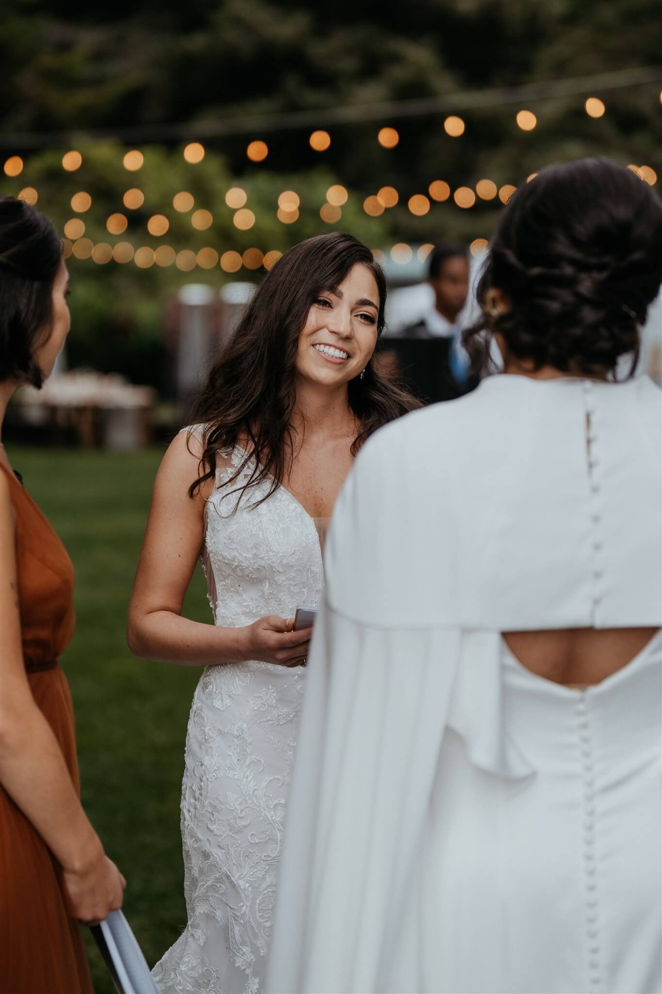 Two brides exchange vows at elegant wedding ceremony on the Oregon Coast