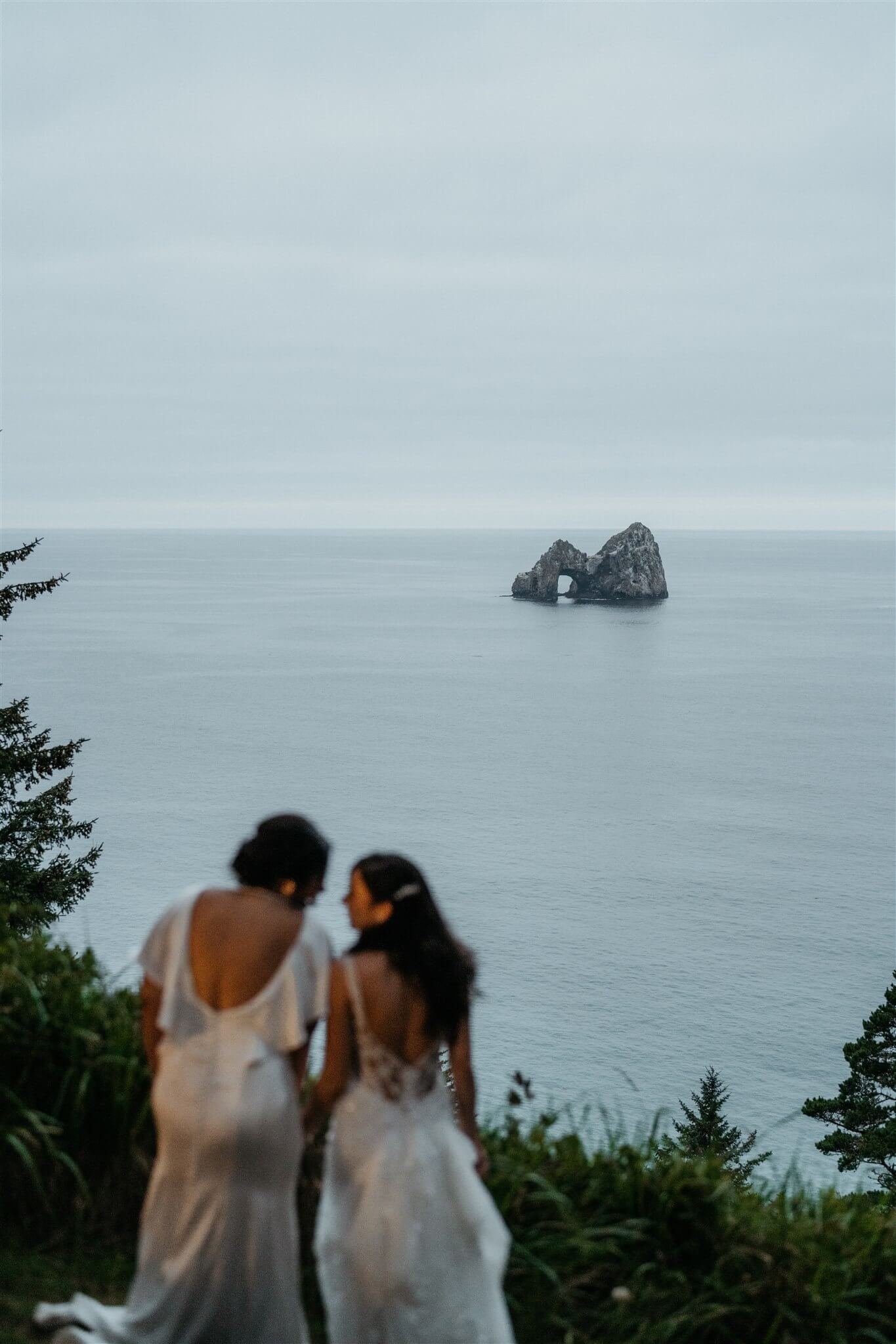 Bride couple portraits at wedding with lots of flowers on the Oregon Coast