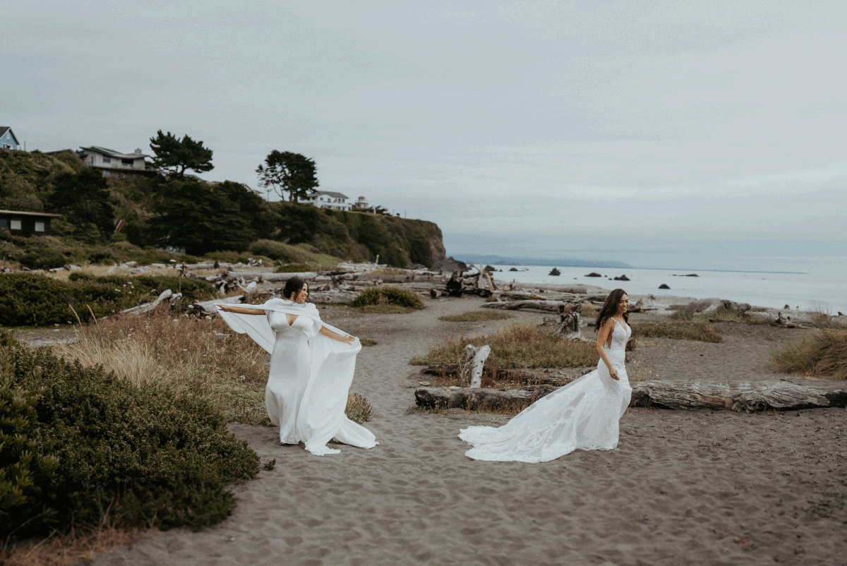 brides twirl around during first look on the beach at two day wedding in Oregon