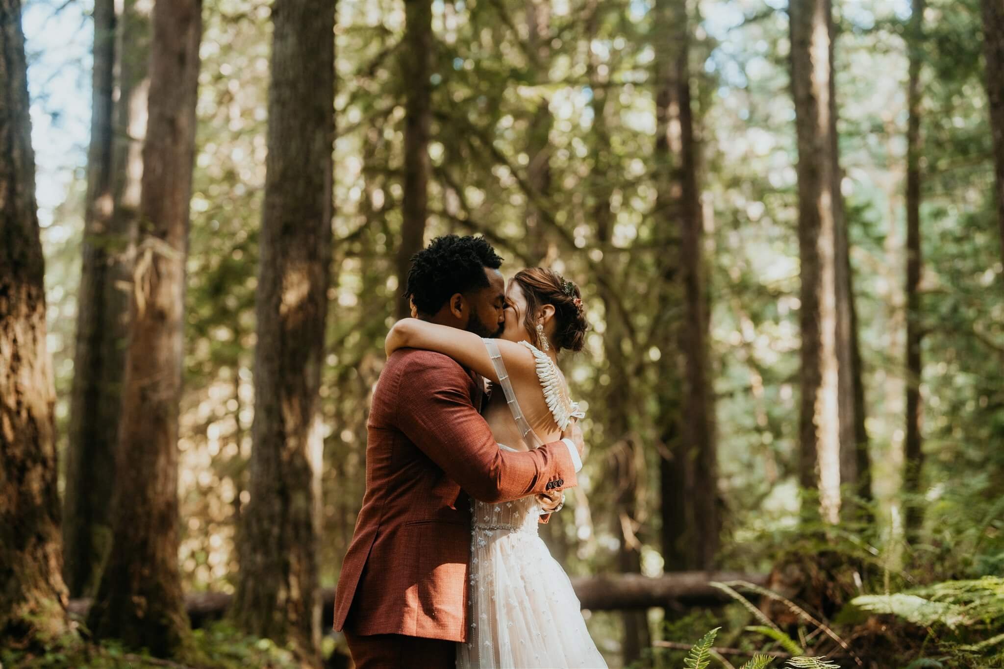Bride and groom hug in the forest at their North Cascades elopement