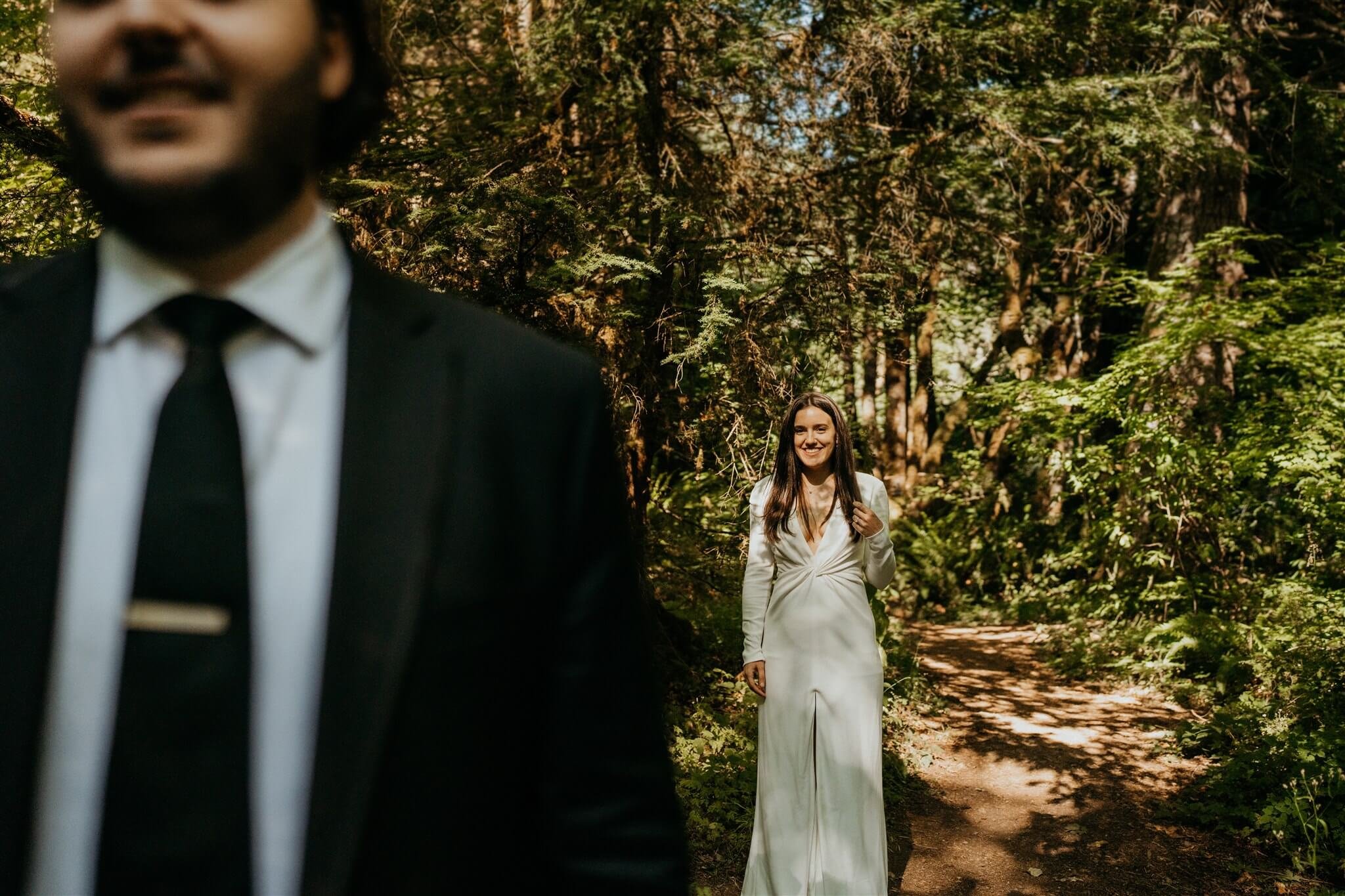 Bride and groom first look in the woods at Wellspring Spa