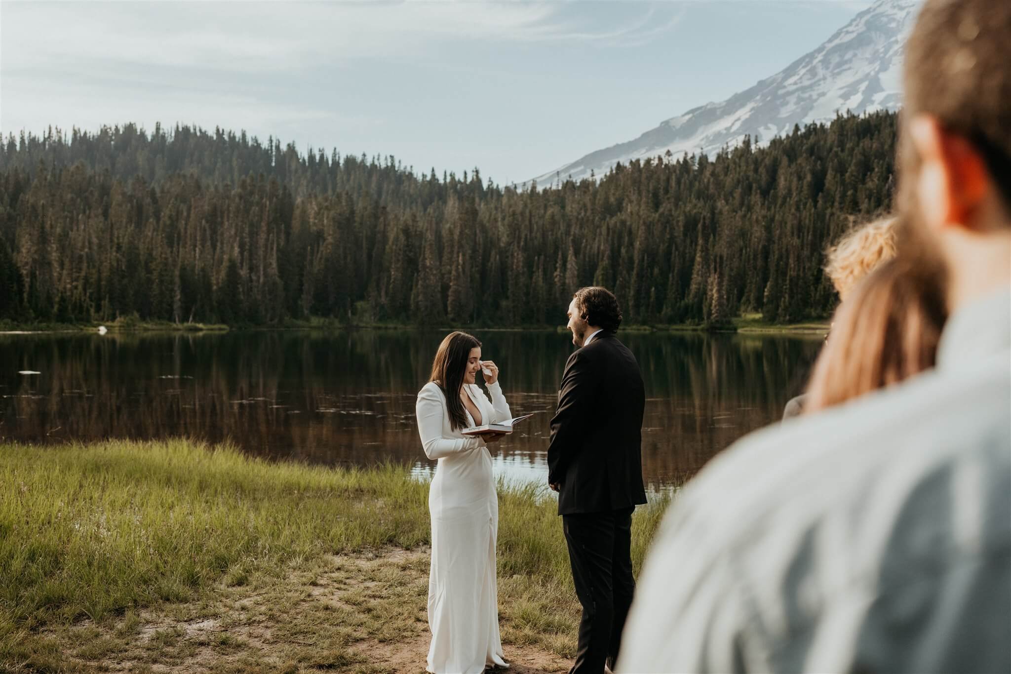 Bride gets emotional during vow reading at Mount Rainier elopement