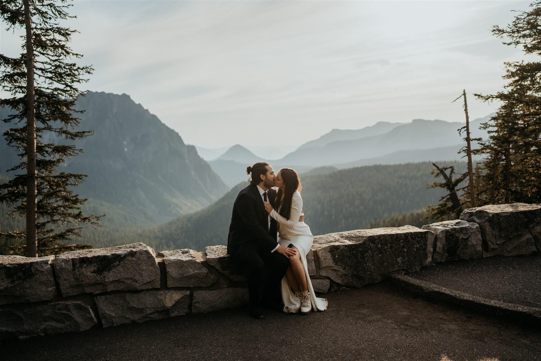 Bride and groom kiss at Mount Rainier overlook