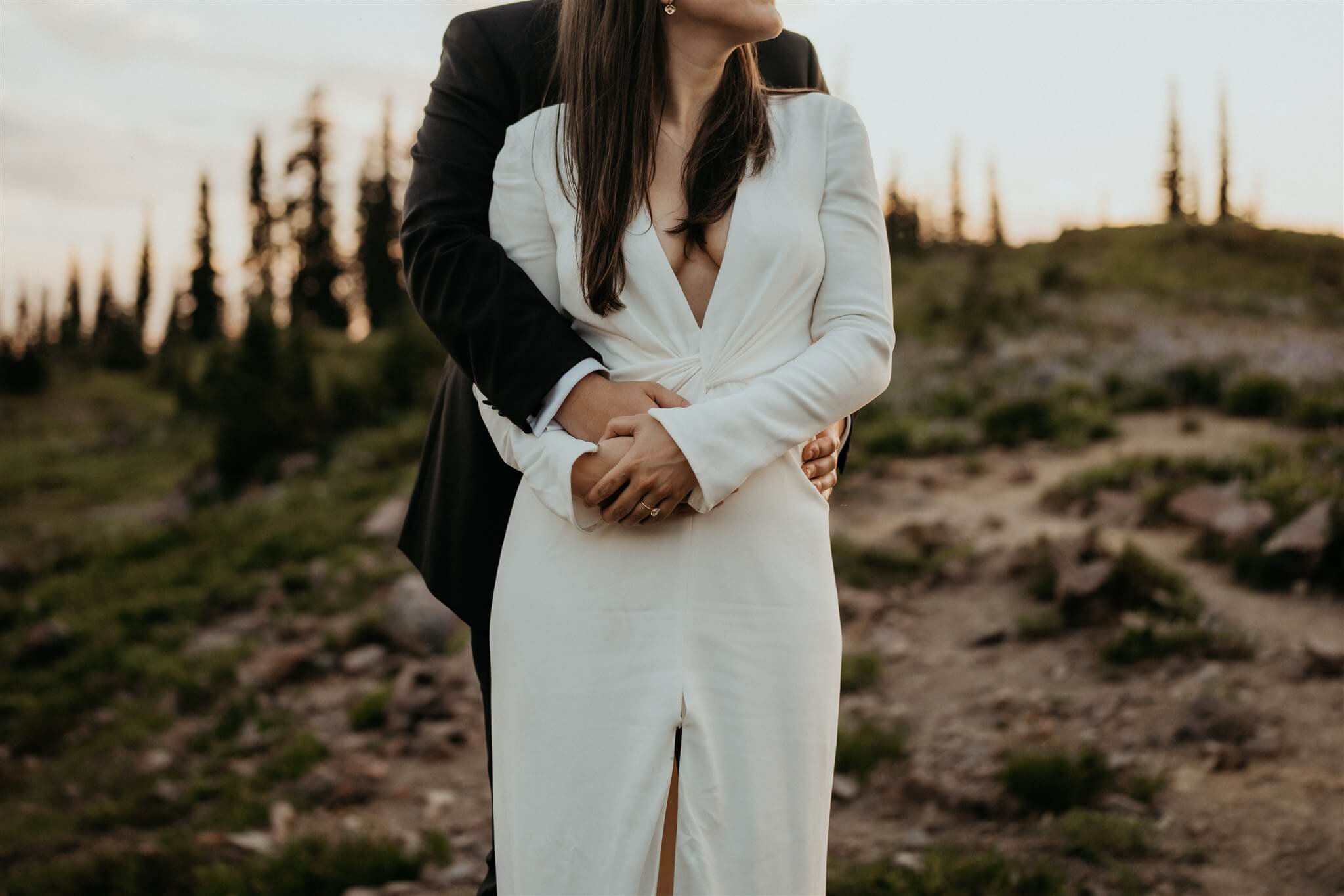 Couple embracing during sunset portraits at Mt Rainier elopement
