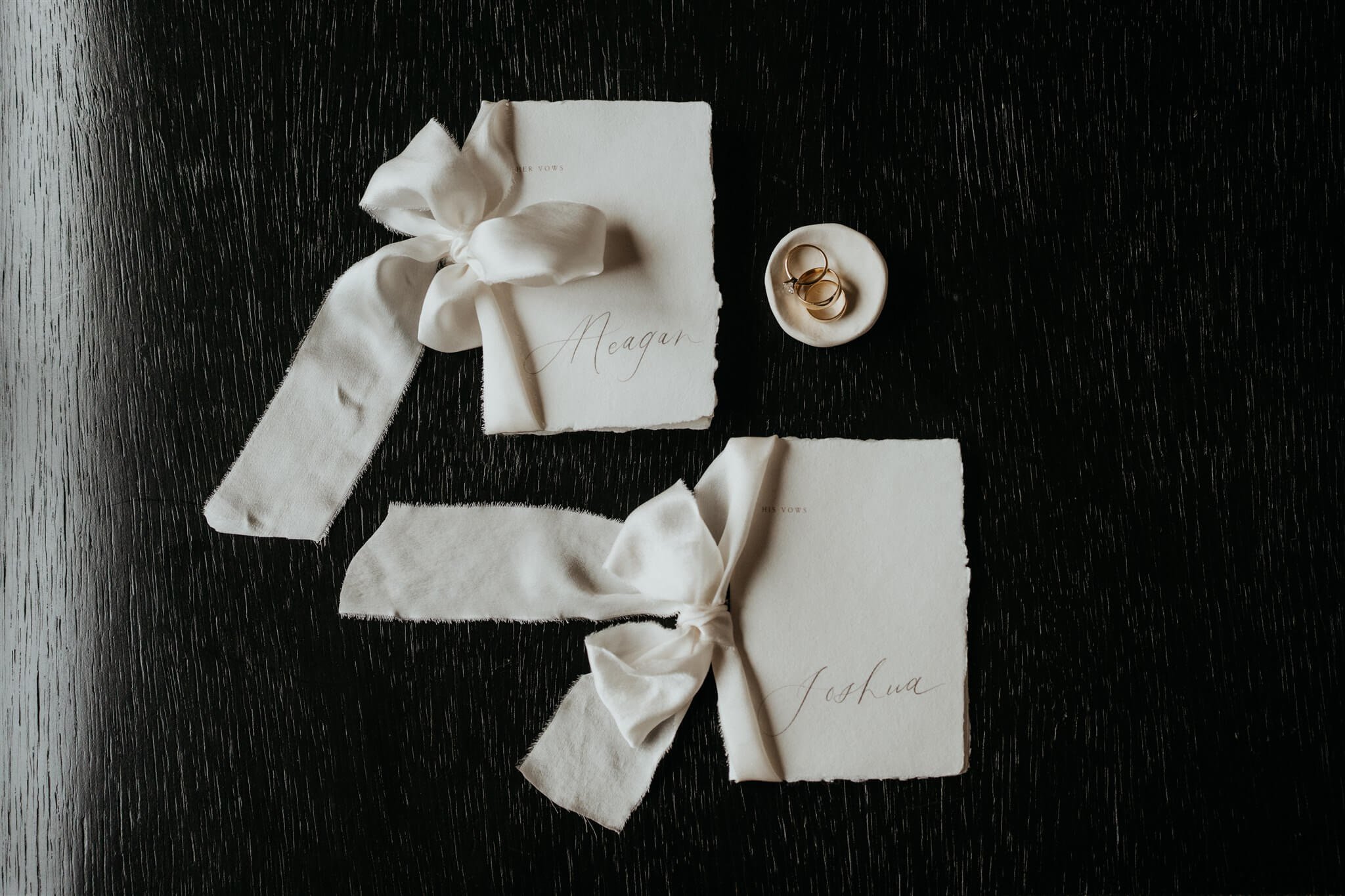 White vow books with ribbons