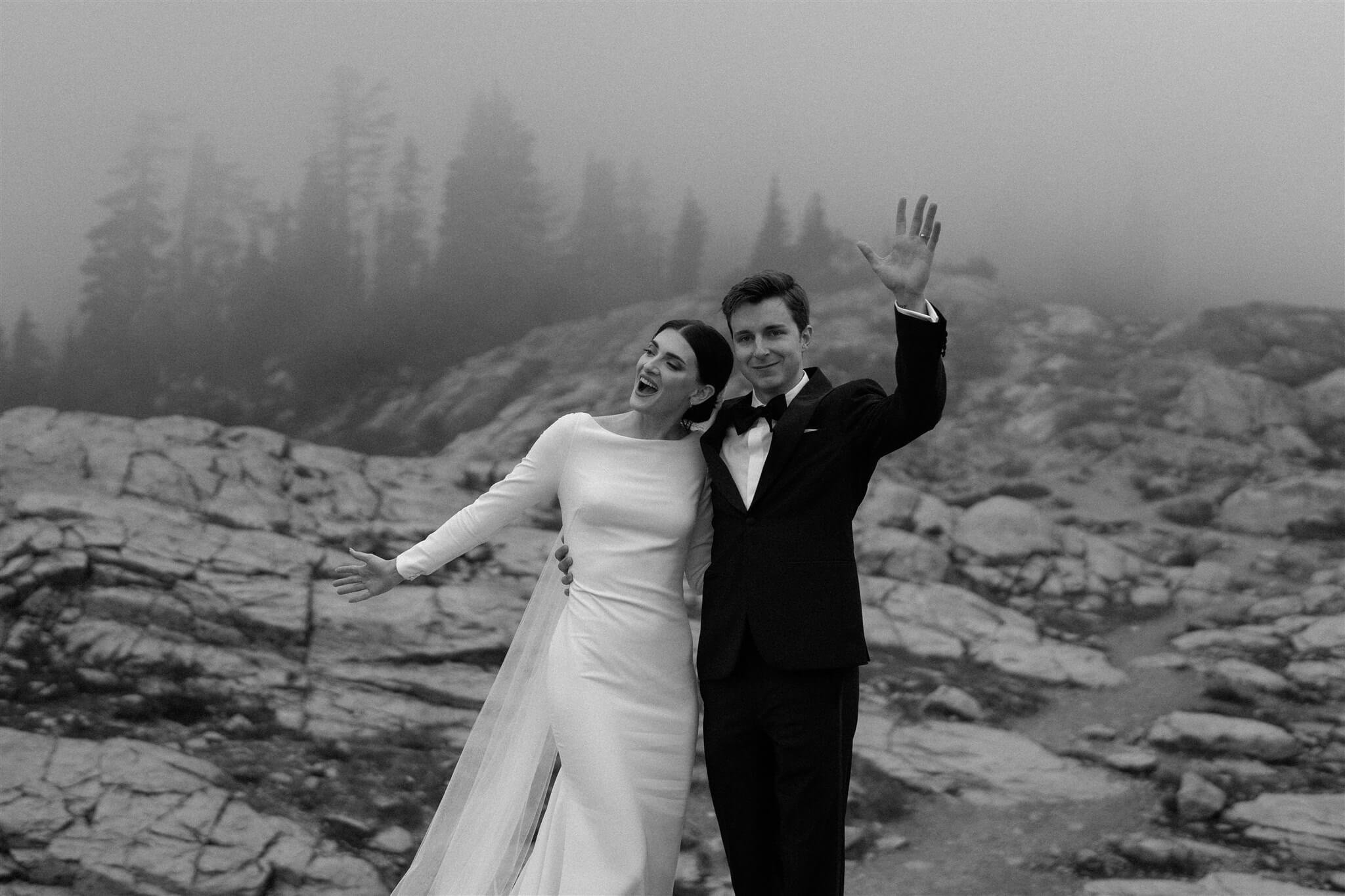 Bride and groom cheer after outdoor wedding ceremony at Artist Point