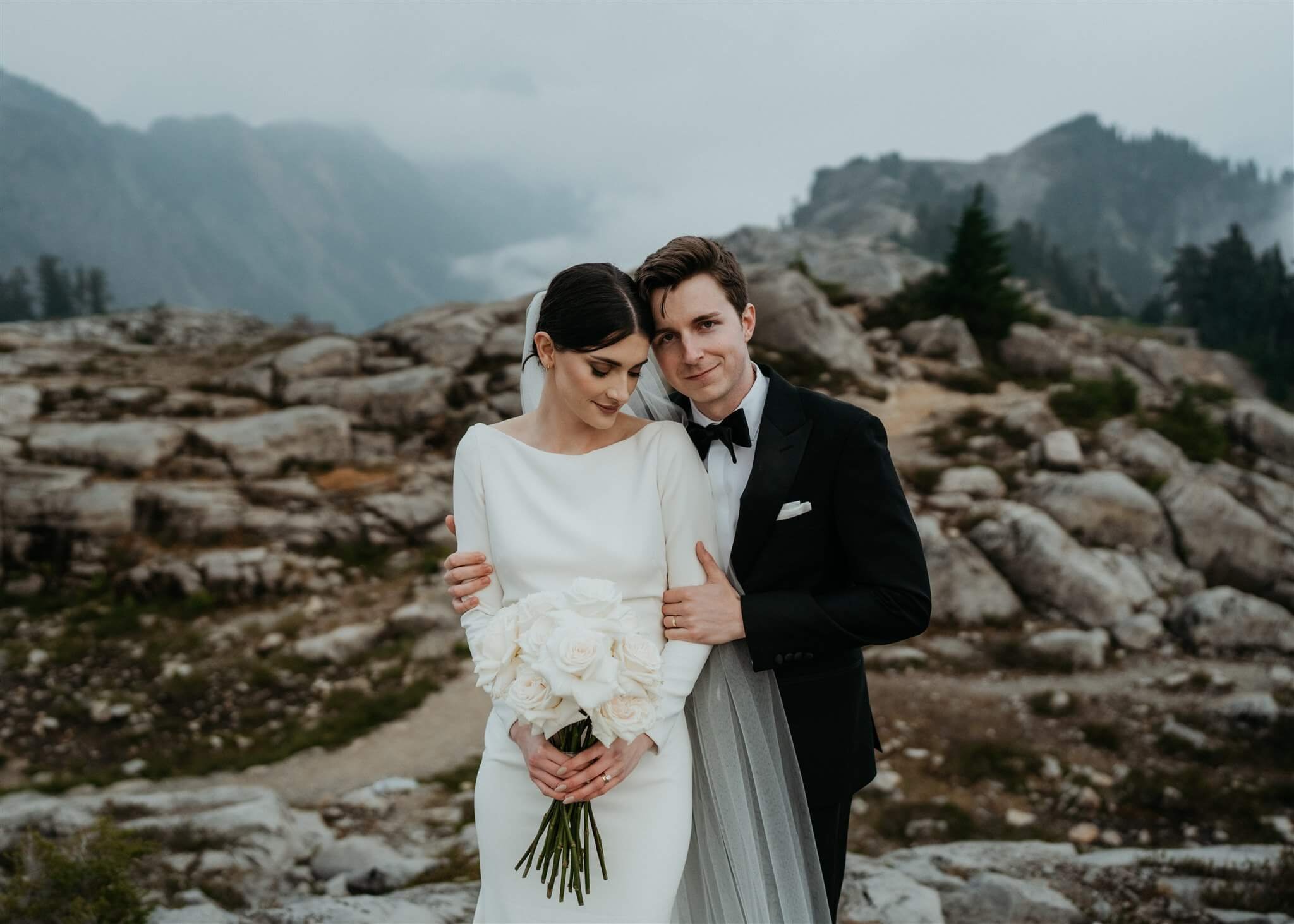 Bride and groom hug during outdoor wedding photos in the North Cascade mountains