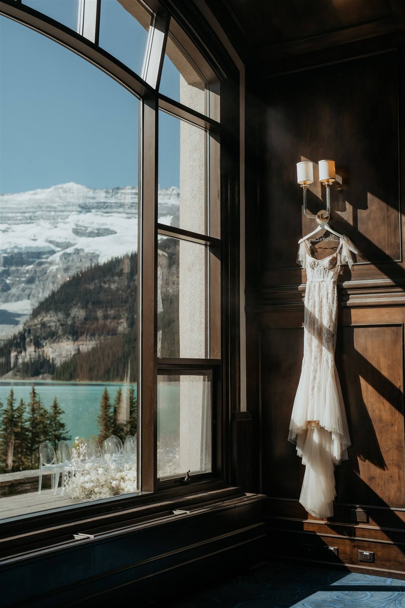 White Berta Privee wedding dress hanging at the Fairmont Chateau Lake Louise