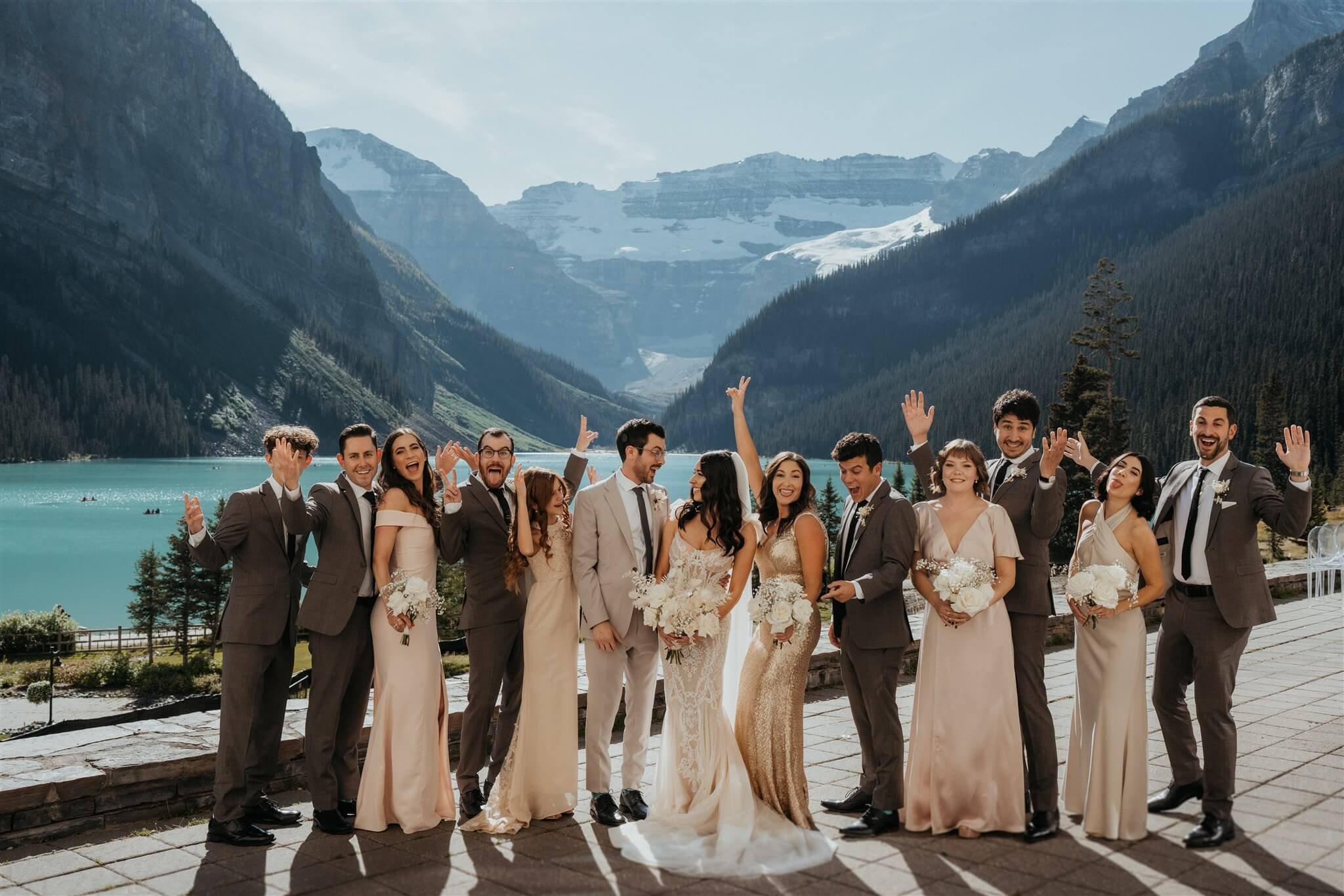 Wedding party cheer at Lake Louise wedding in Alberta Canada