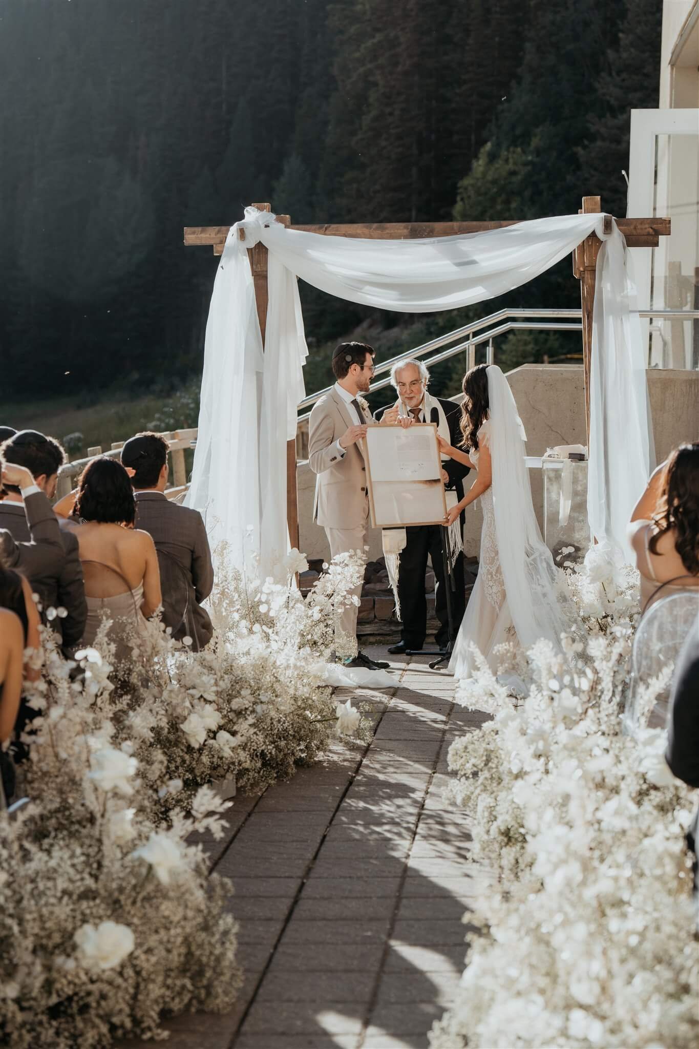 Ketubah reading at outdoor wedding ceremony at Lake Louise