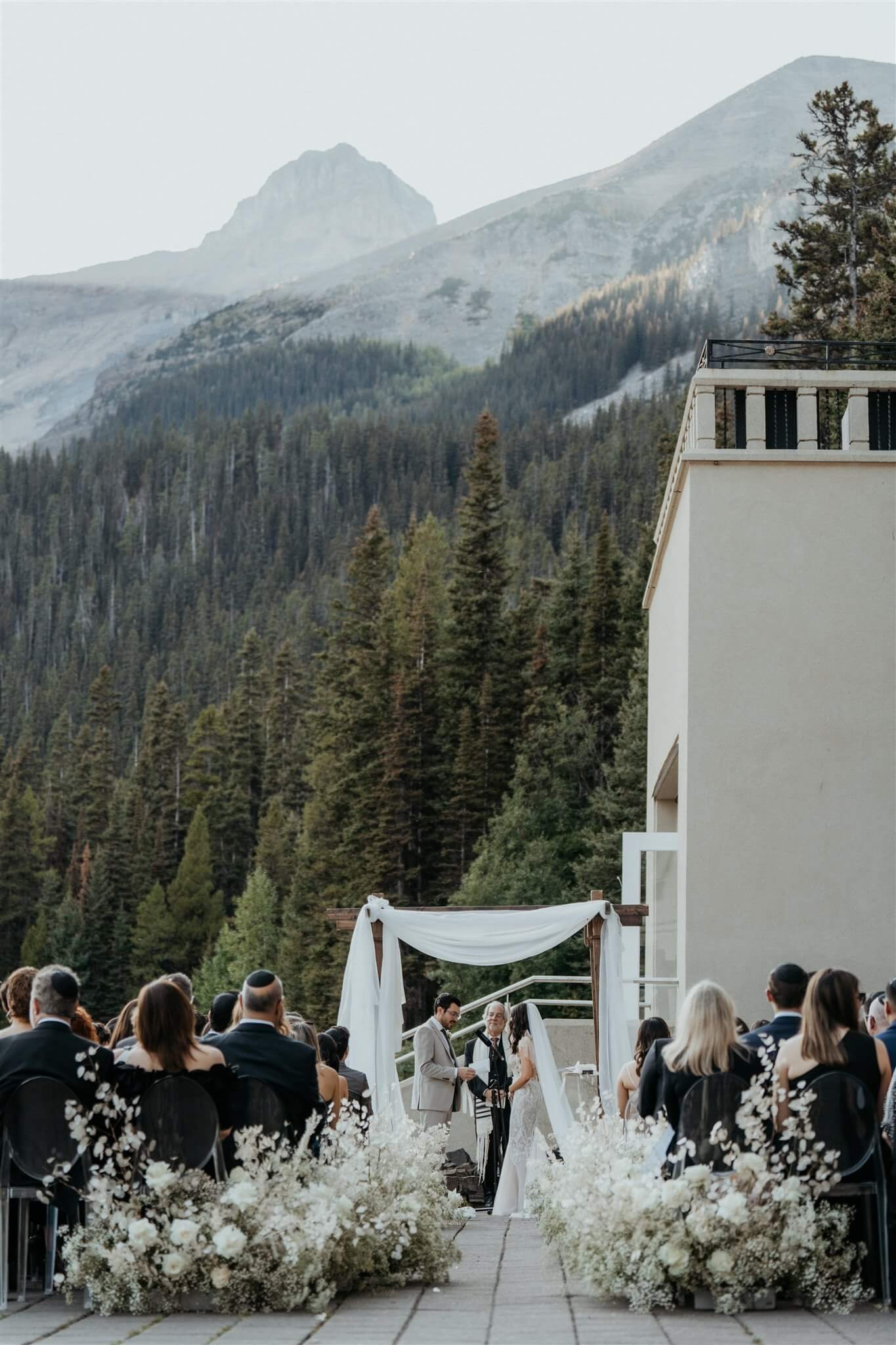 Outdoor wedding ceremony by Lake Louise in Alberta Canada