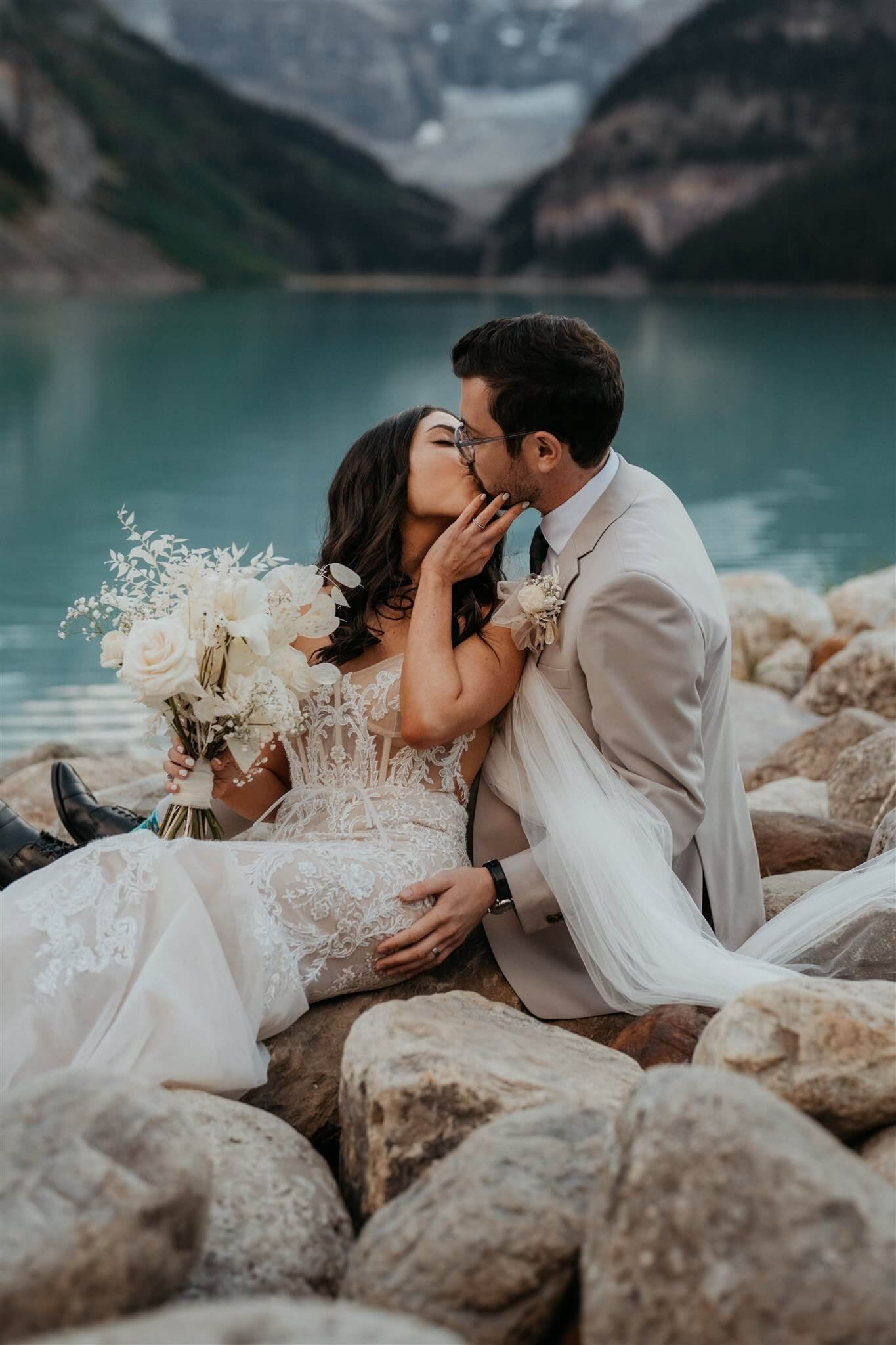 Bride and groom outdoor couple portraits at luxury venue at Lake Louise