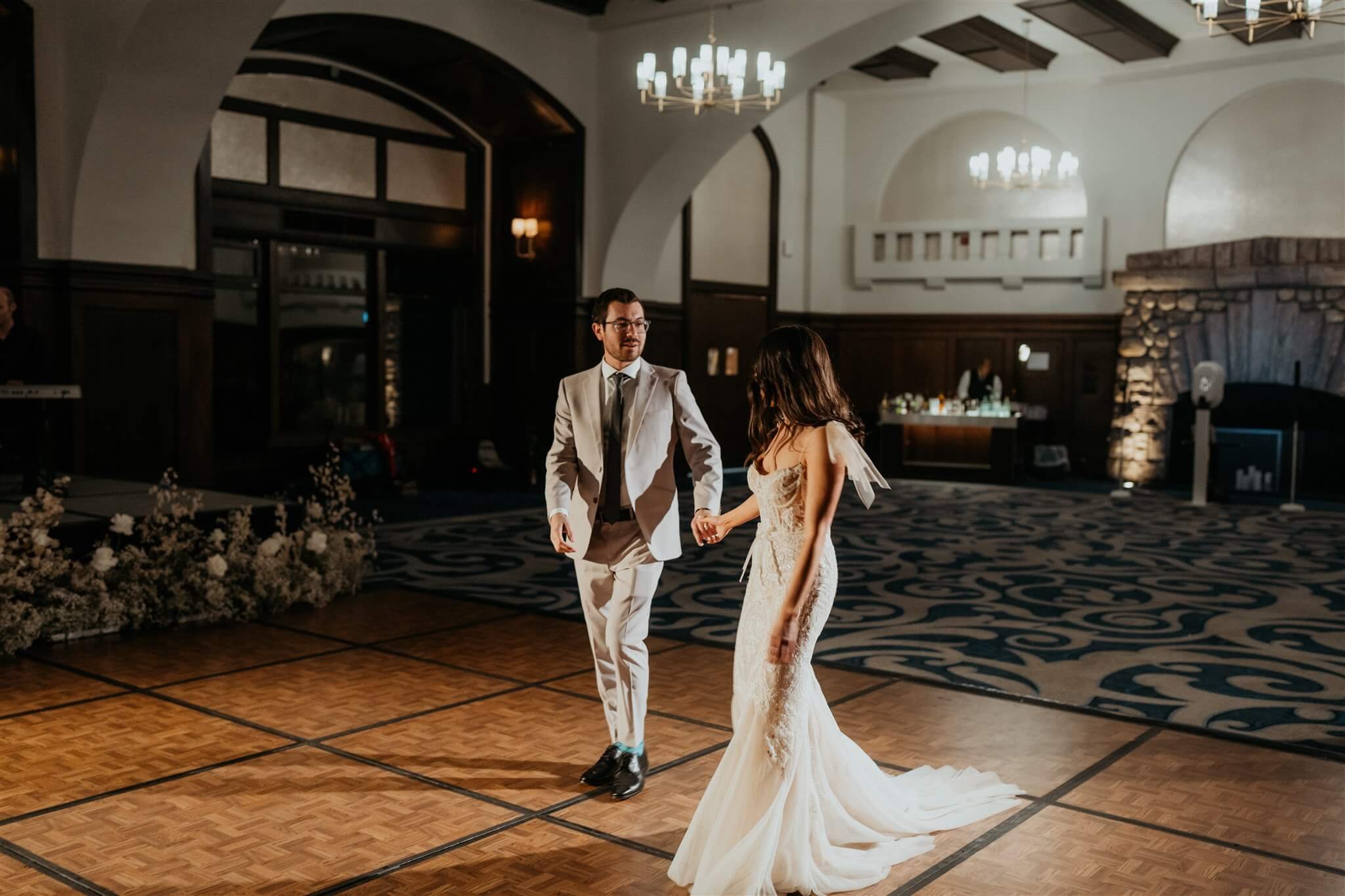 Bride and groom first dance on the dance floor at Lake Louise wedding