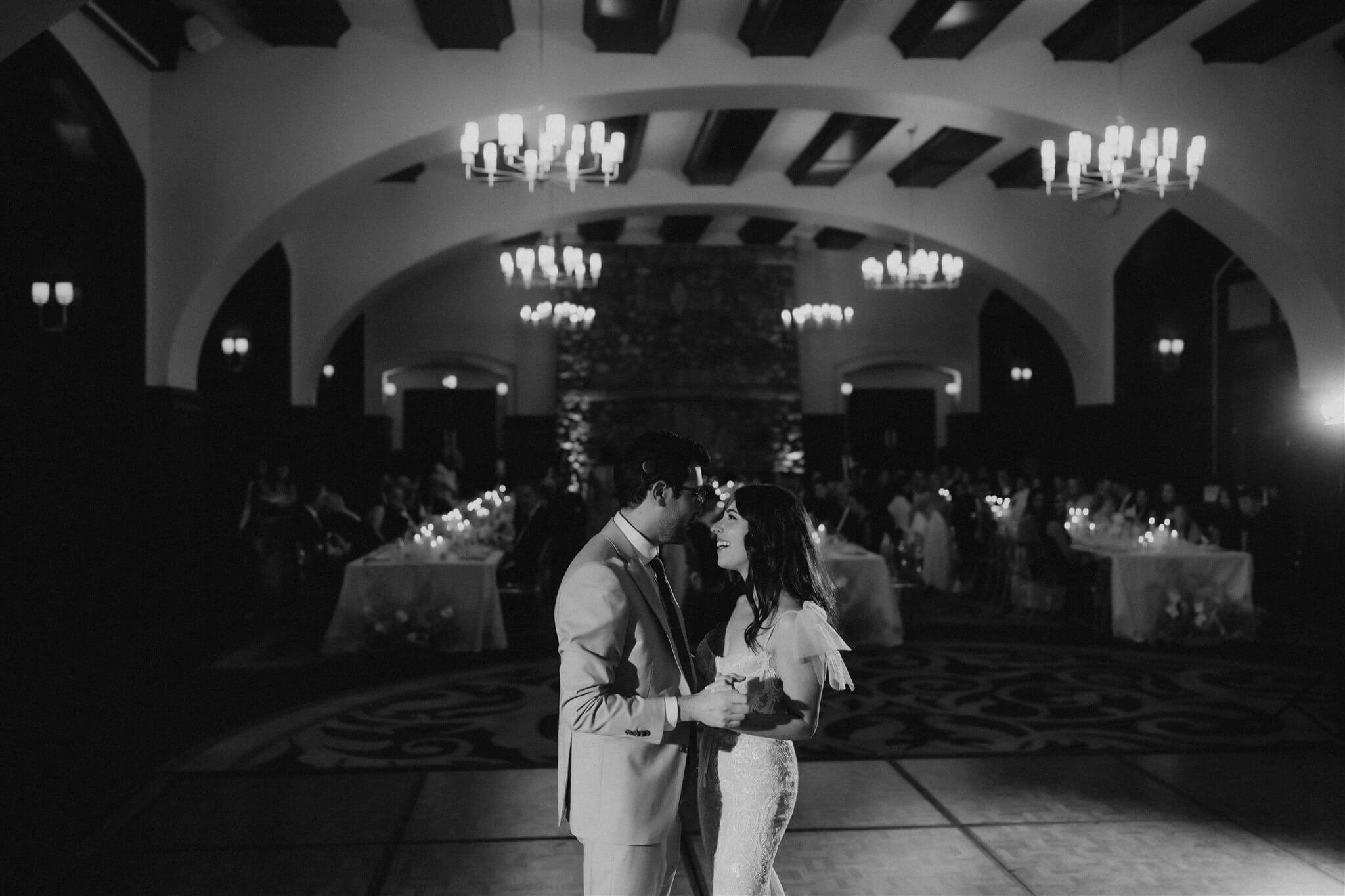 Bride and groom first dance on the dance floor at Lake Louise wedding