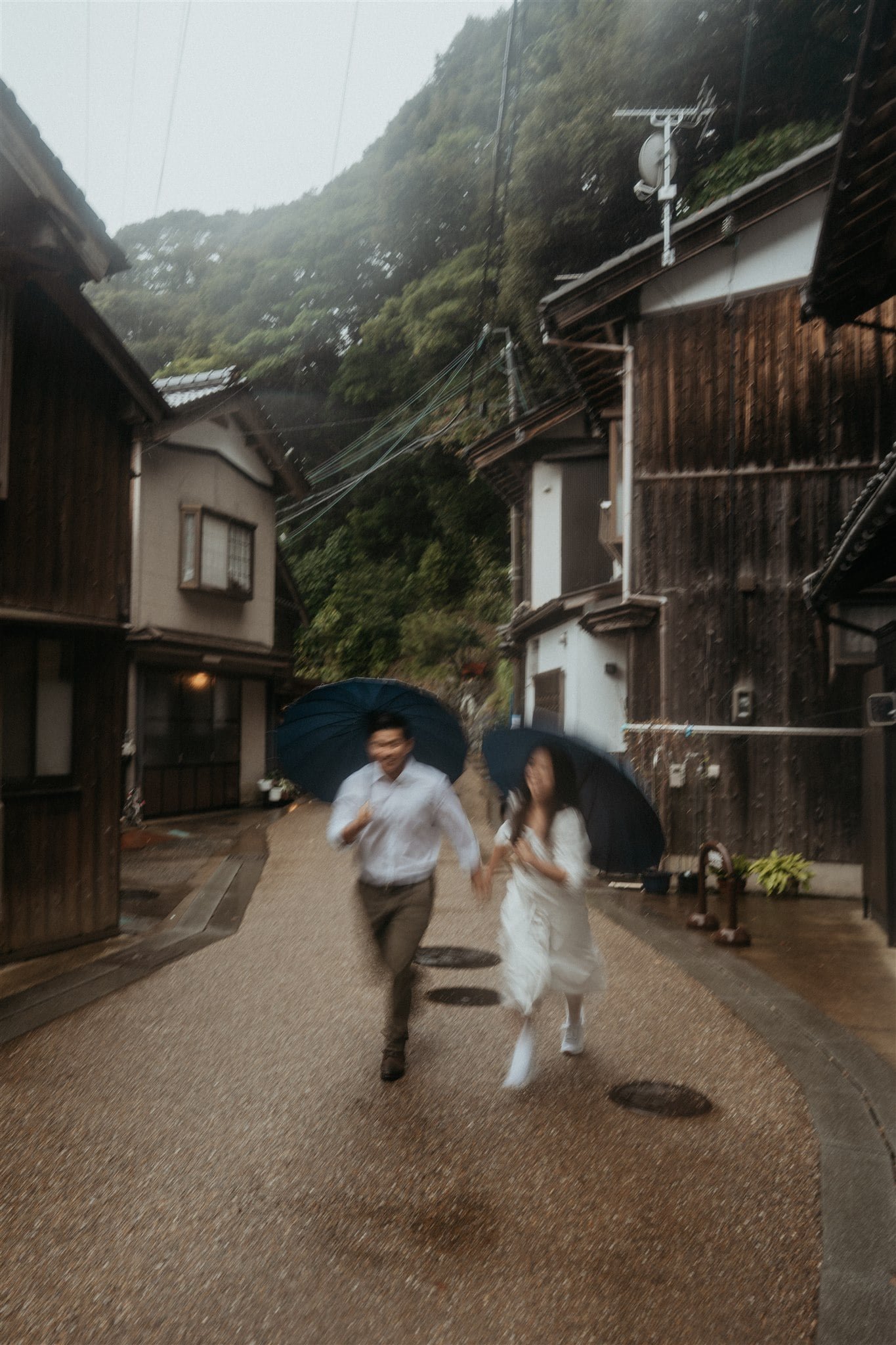 Bride and groom run through the streets of Kyoto for their Japan elopement portraits