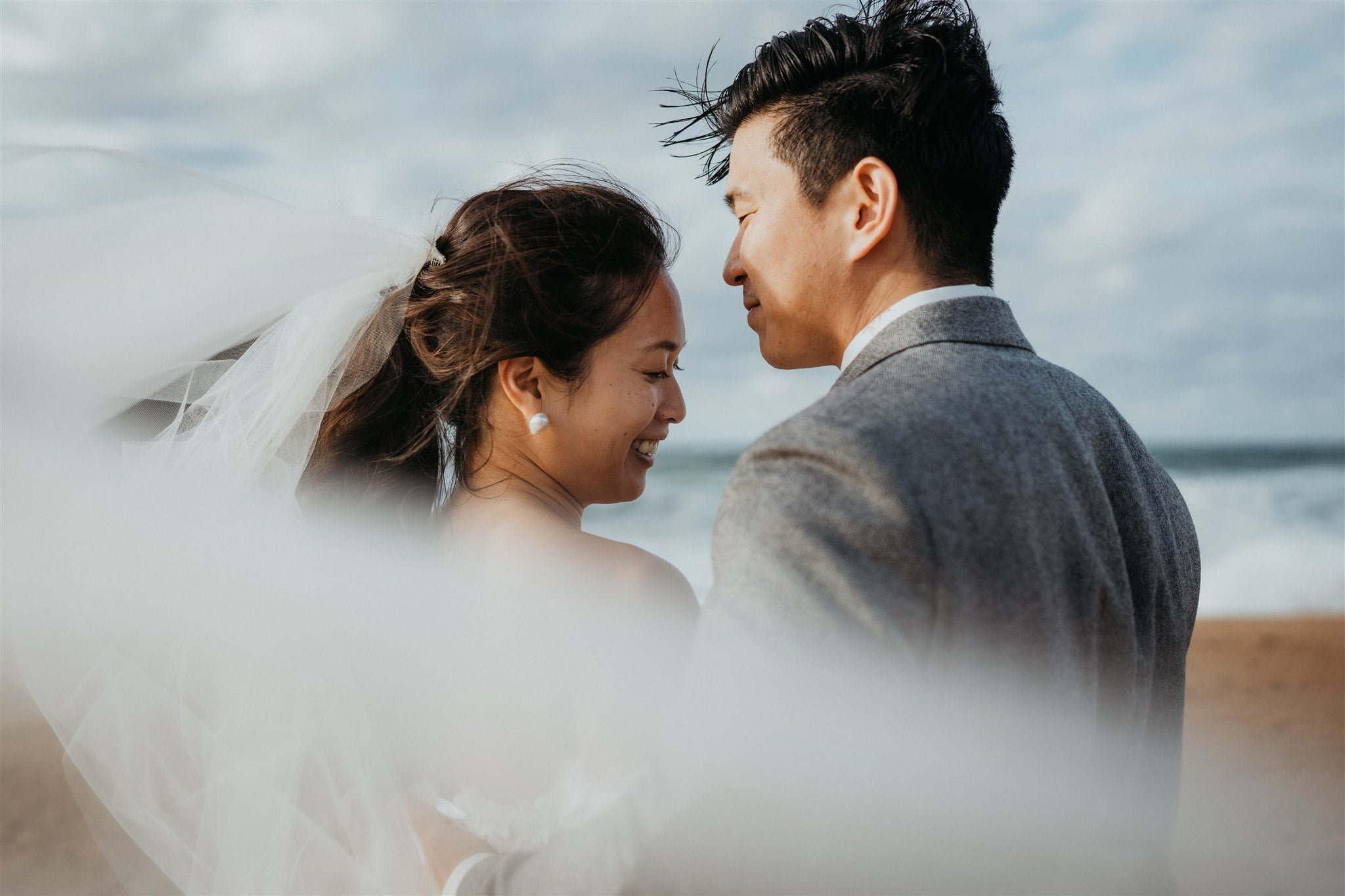 Bride and groom elopement portraits on the beach in Kyoto, Japan