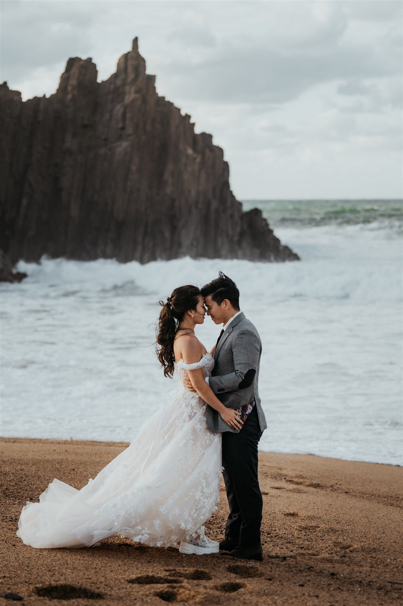 Bride and groom elopement portraits on the beach in Kyoto, Japan