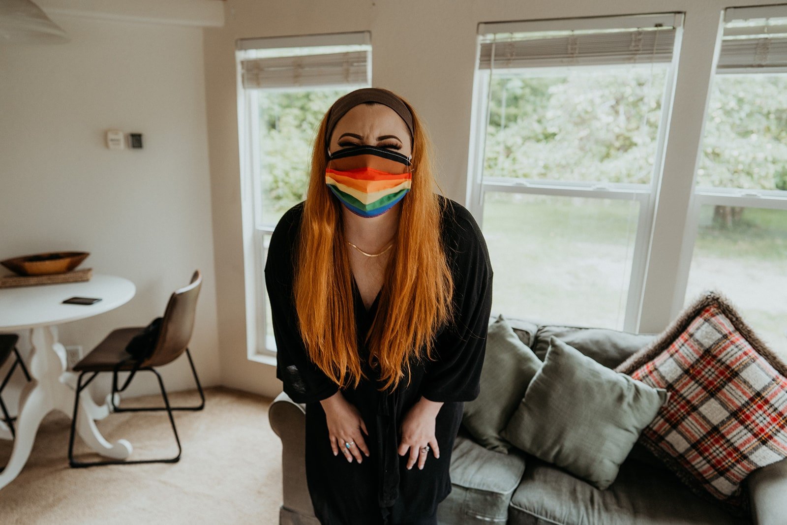 Bride wearing rainbow face mask while getting ready for her elopement at Rialto Beach