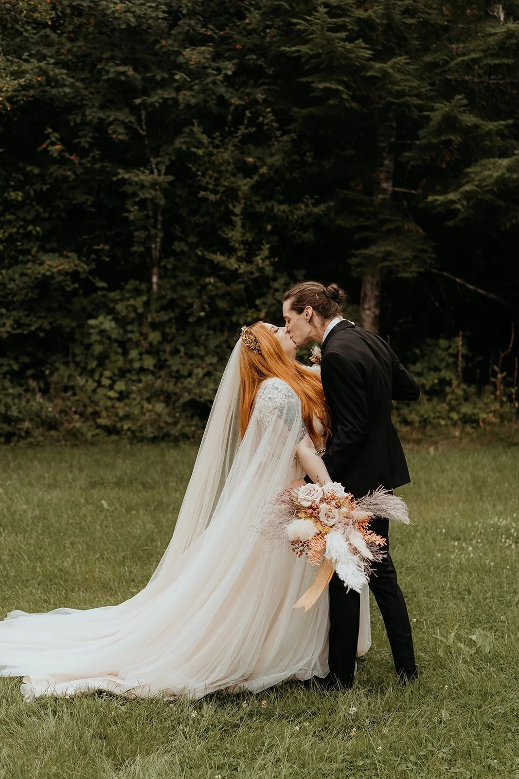 Bride and groom kiss after wedding first look