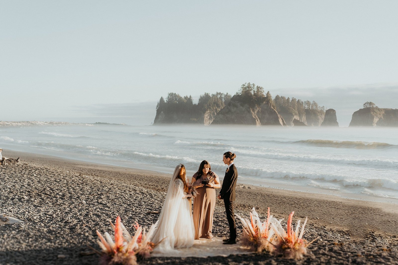 Outdoor wedding ceremony on the beach at Rialto Beach elopement