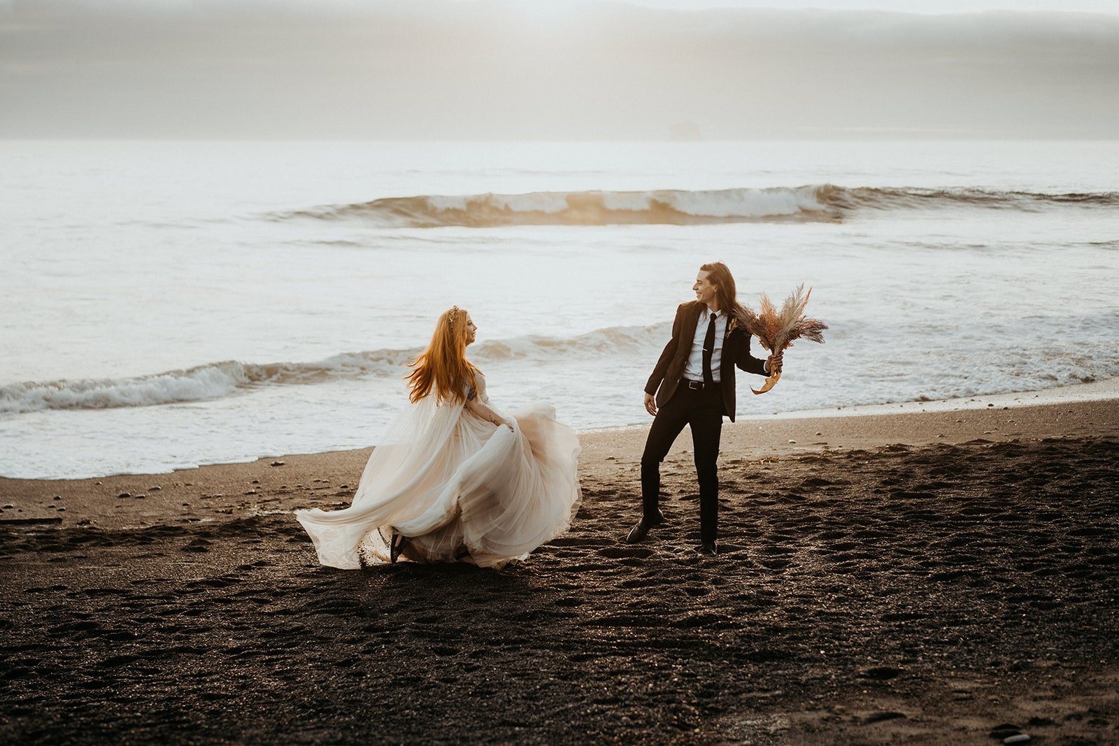 Bride and groom dance on the beach after their elopement at Rialto Beach